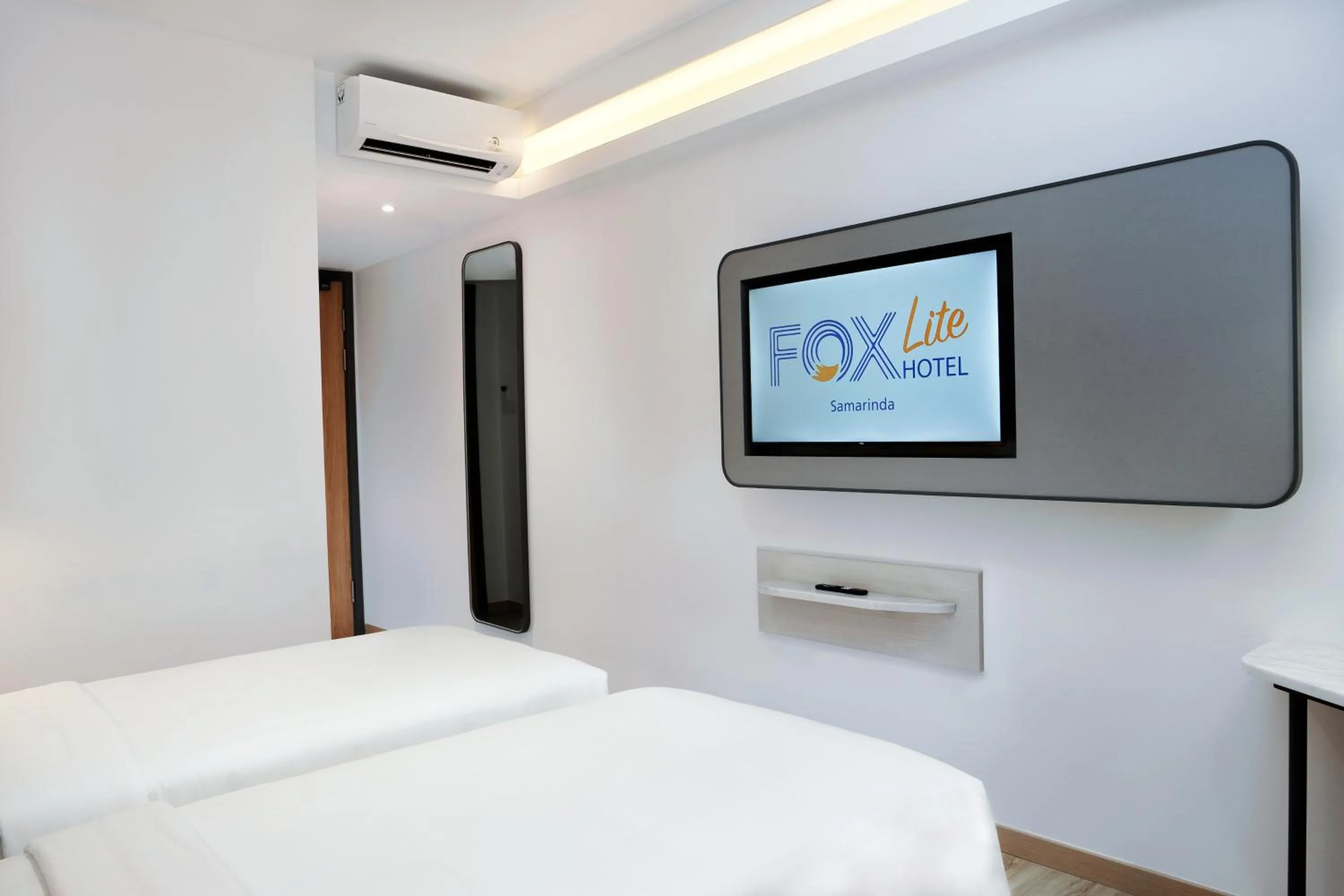 Photo of the whole room, Bed in FOX Lite Hotel Samarinda