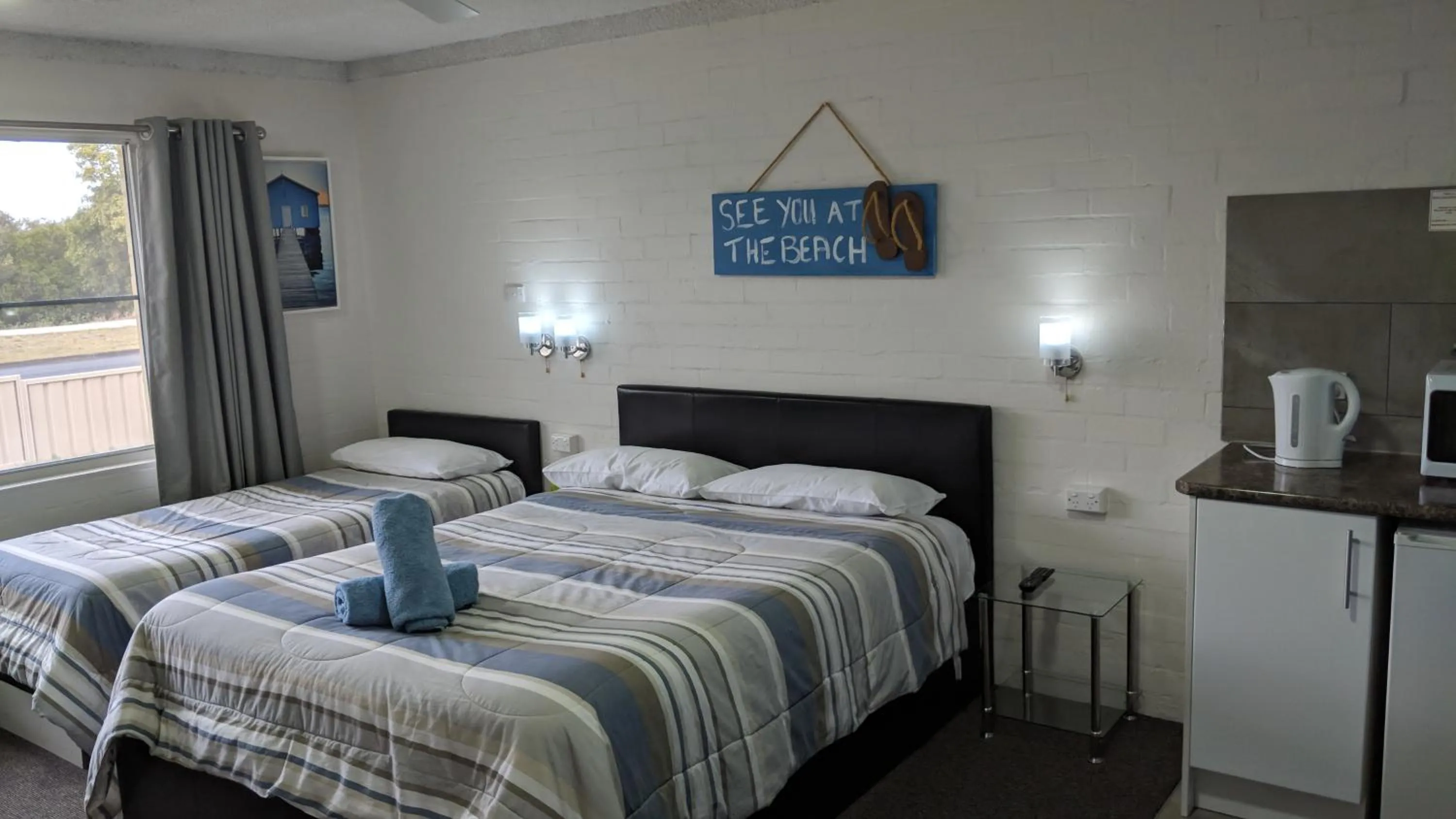 Bed in Harrington Village Motel