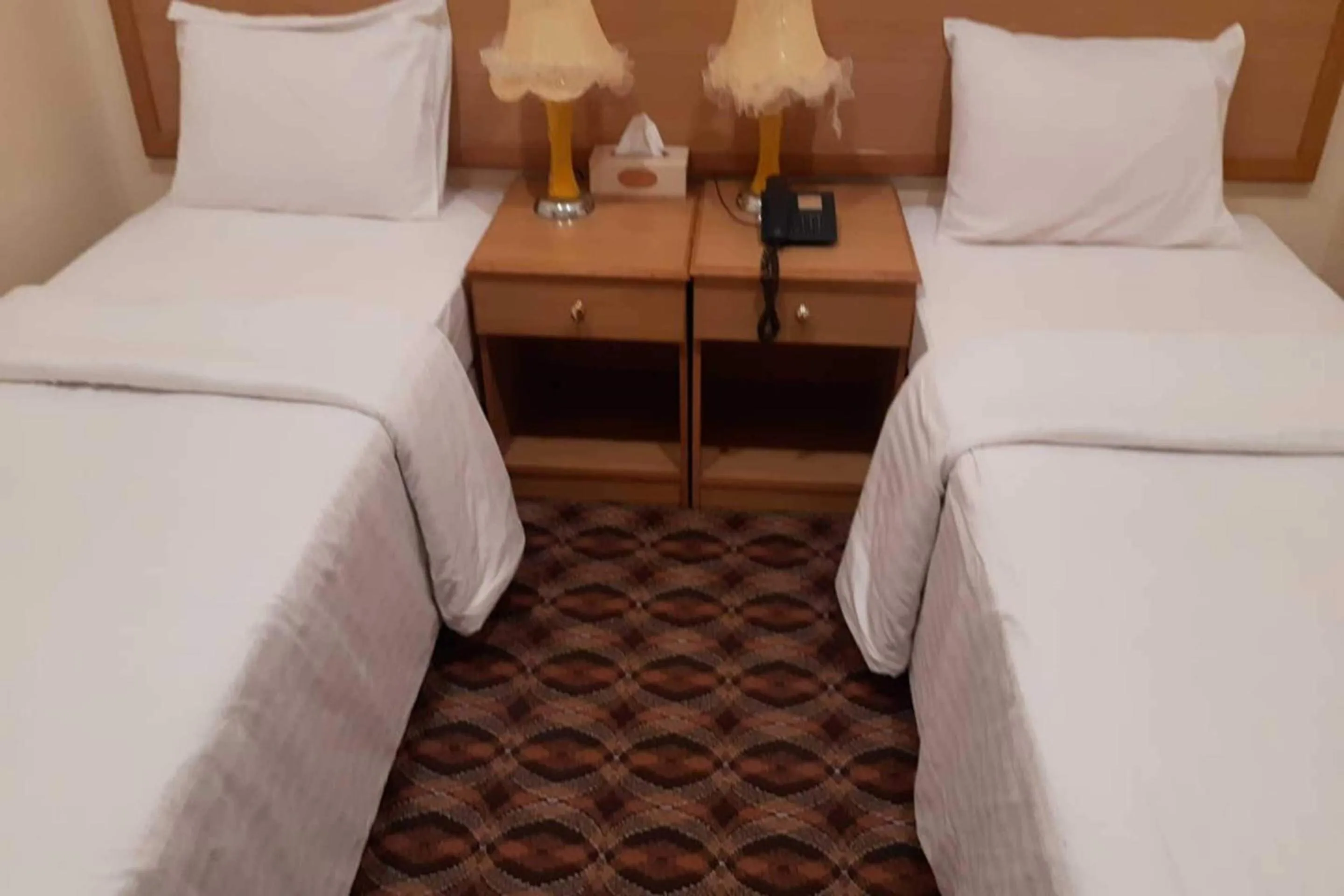 Bedroom, Bed in OYO 142 Al Sharqiya Sands Hotel