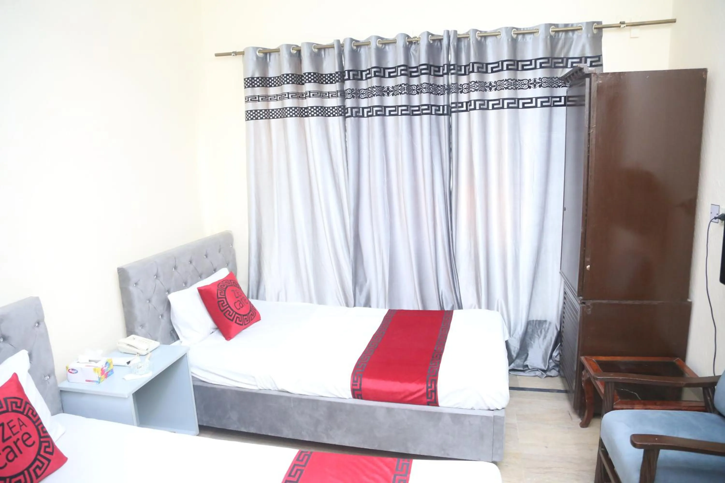 Living room, Bed in Hotel Zea Care Johar Town Lahore