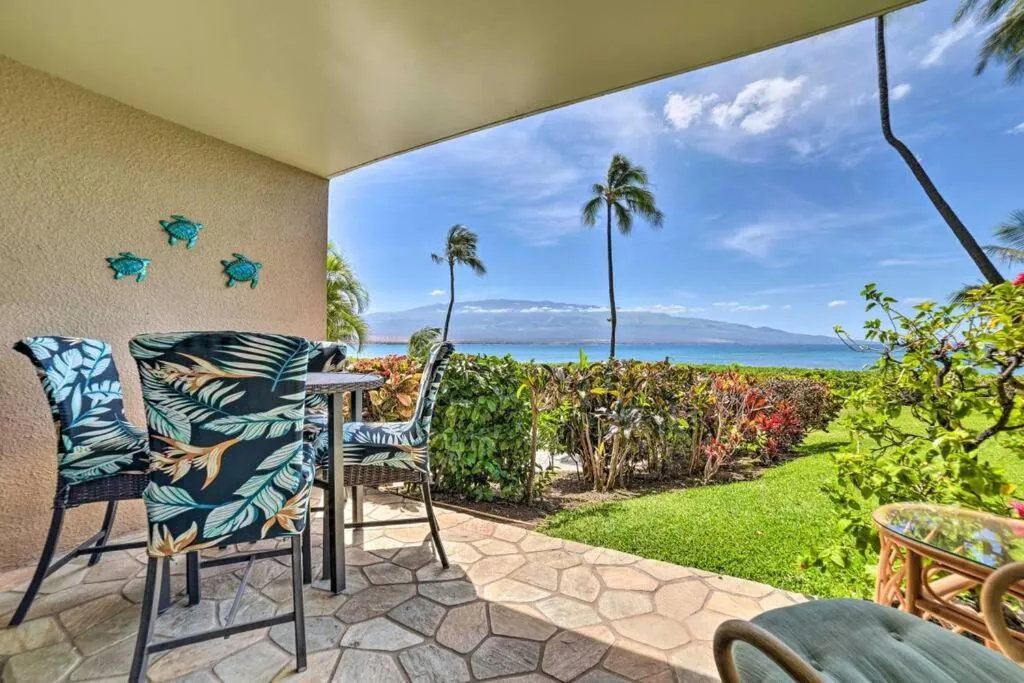 Patio in Stunning Maui Direct Ocean front on the beach, Walk to beach from Condo, Watch Turtles, Whales, AC in all rooms ocean view Pool and Spa