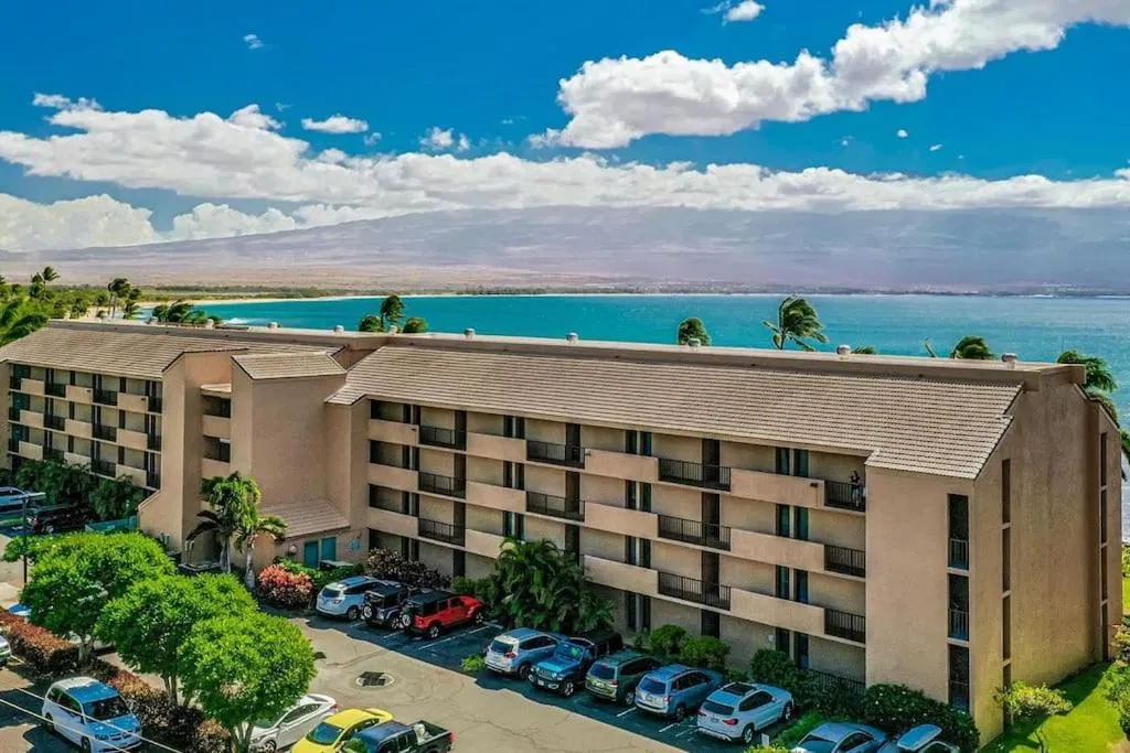 Property building in Stunning Maui Direct Ocean front on the beach, Walk to beach from Condo, Watch Turtles, Whales, AC in all rooms ocean view Pool and Spa
