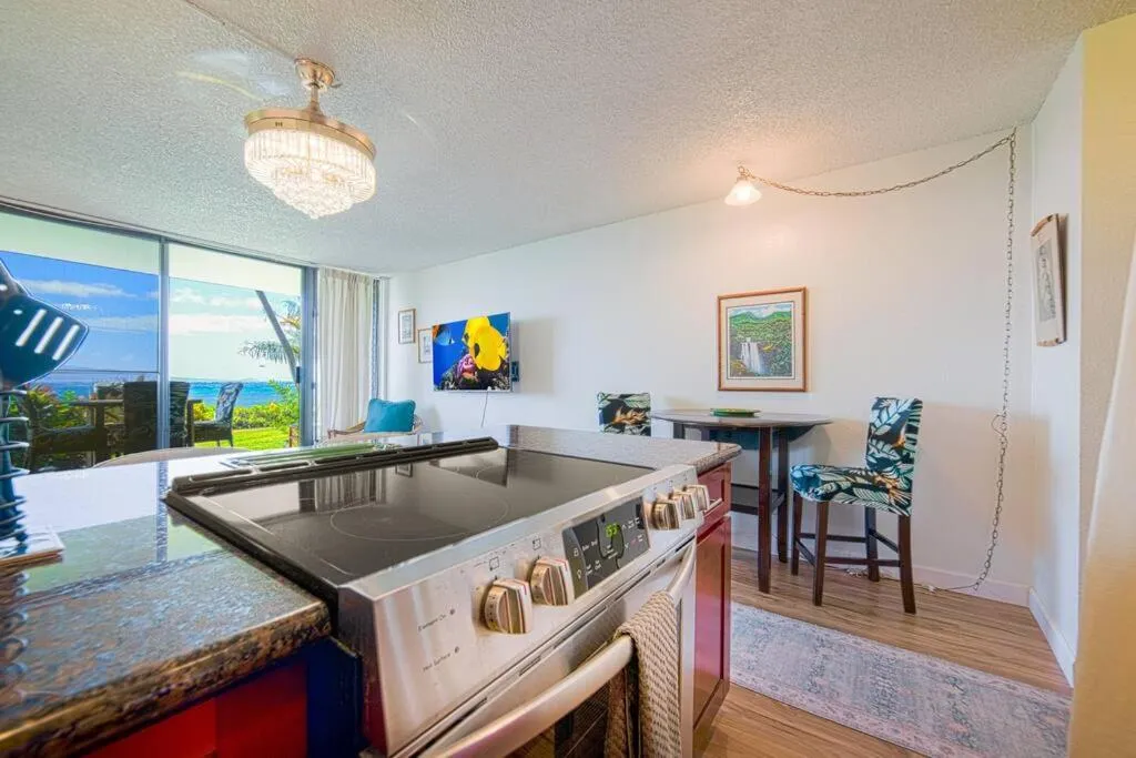 Kitchen or kitchenette in Stunning Maui Direct Ocean front on the beach, Walk to beach from Condo, Watch Turtles, Whales, AC in all rooms ocean view Pool and Spa