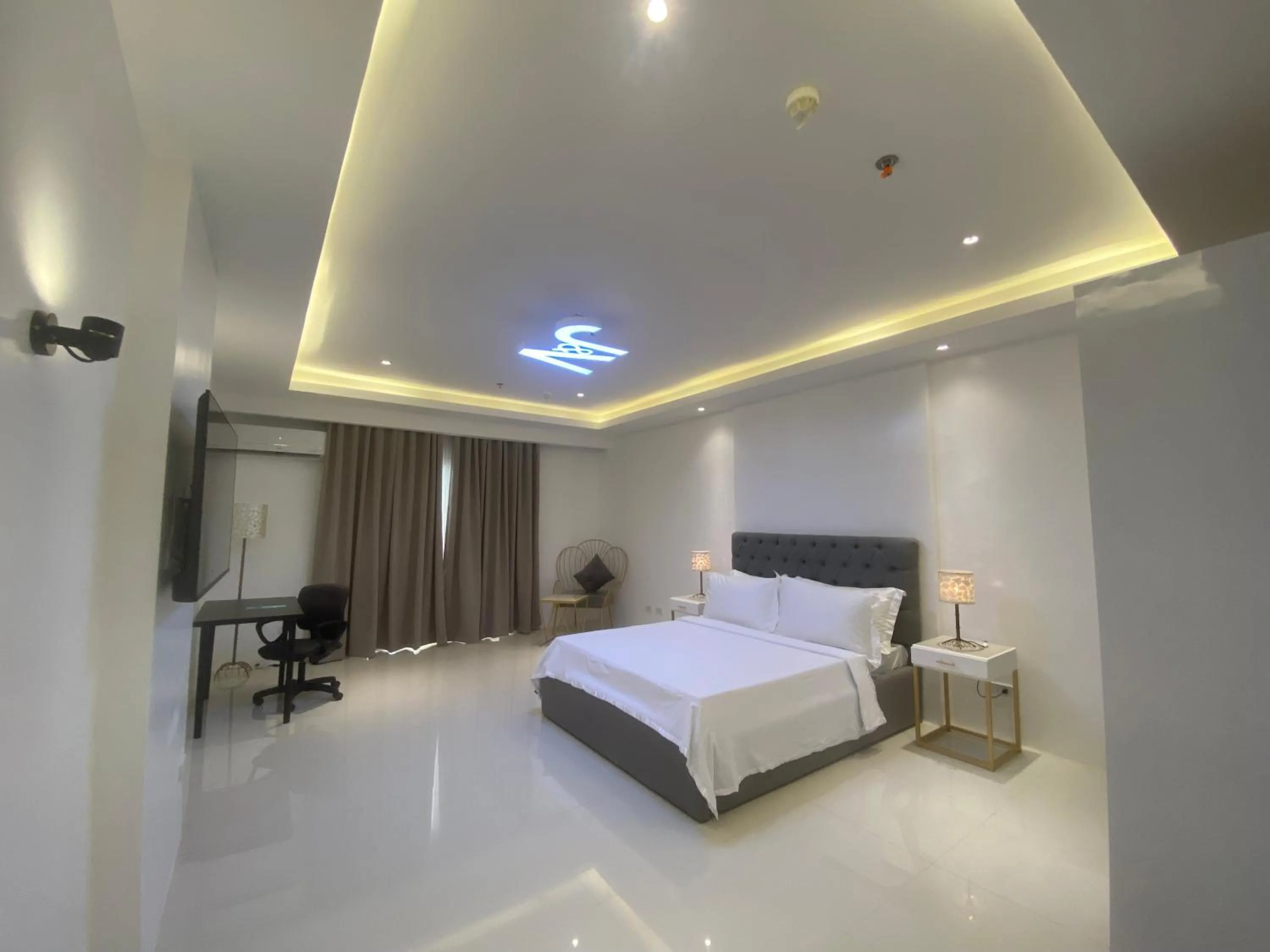 Bed in J&V Hotel and Resort