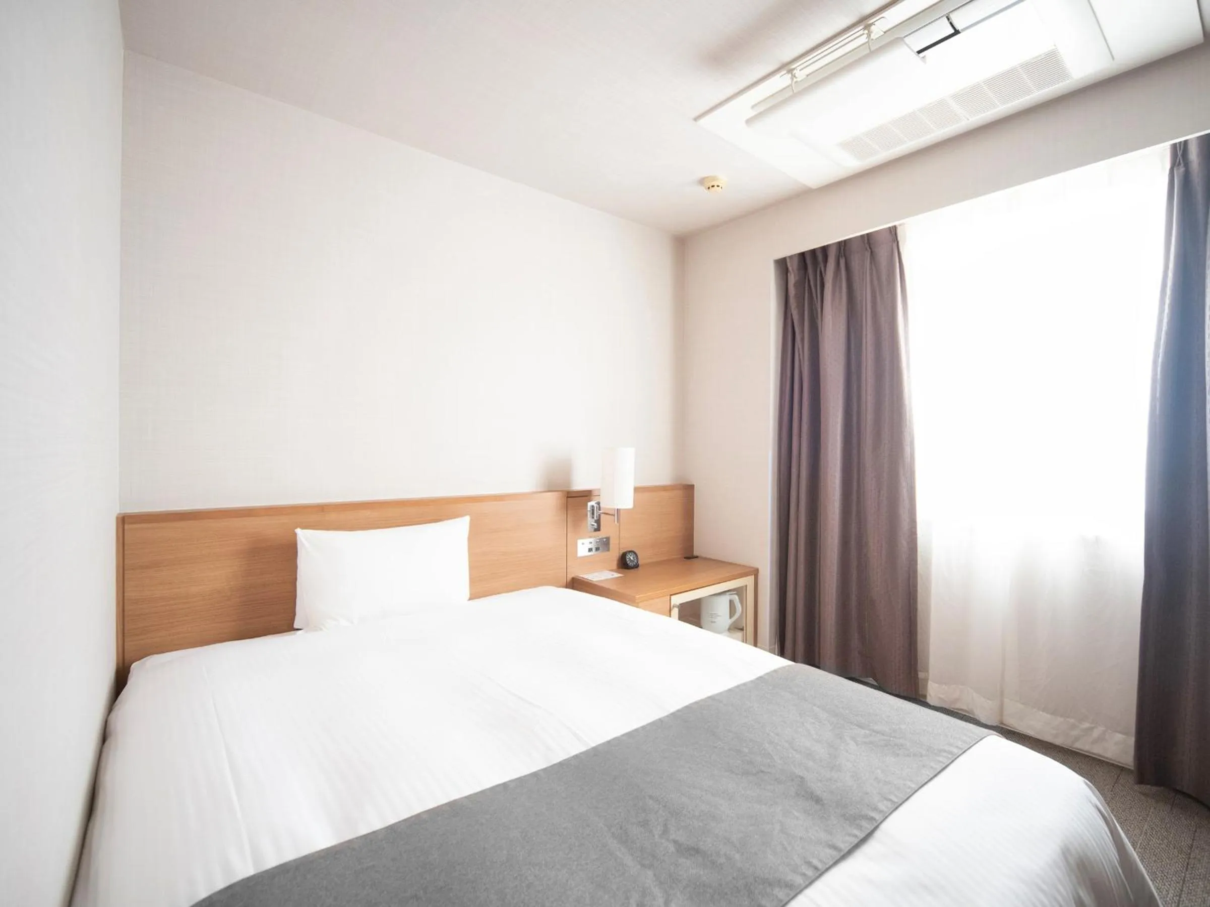 Bed in Vessel Inn Fukuyama Station