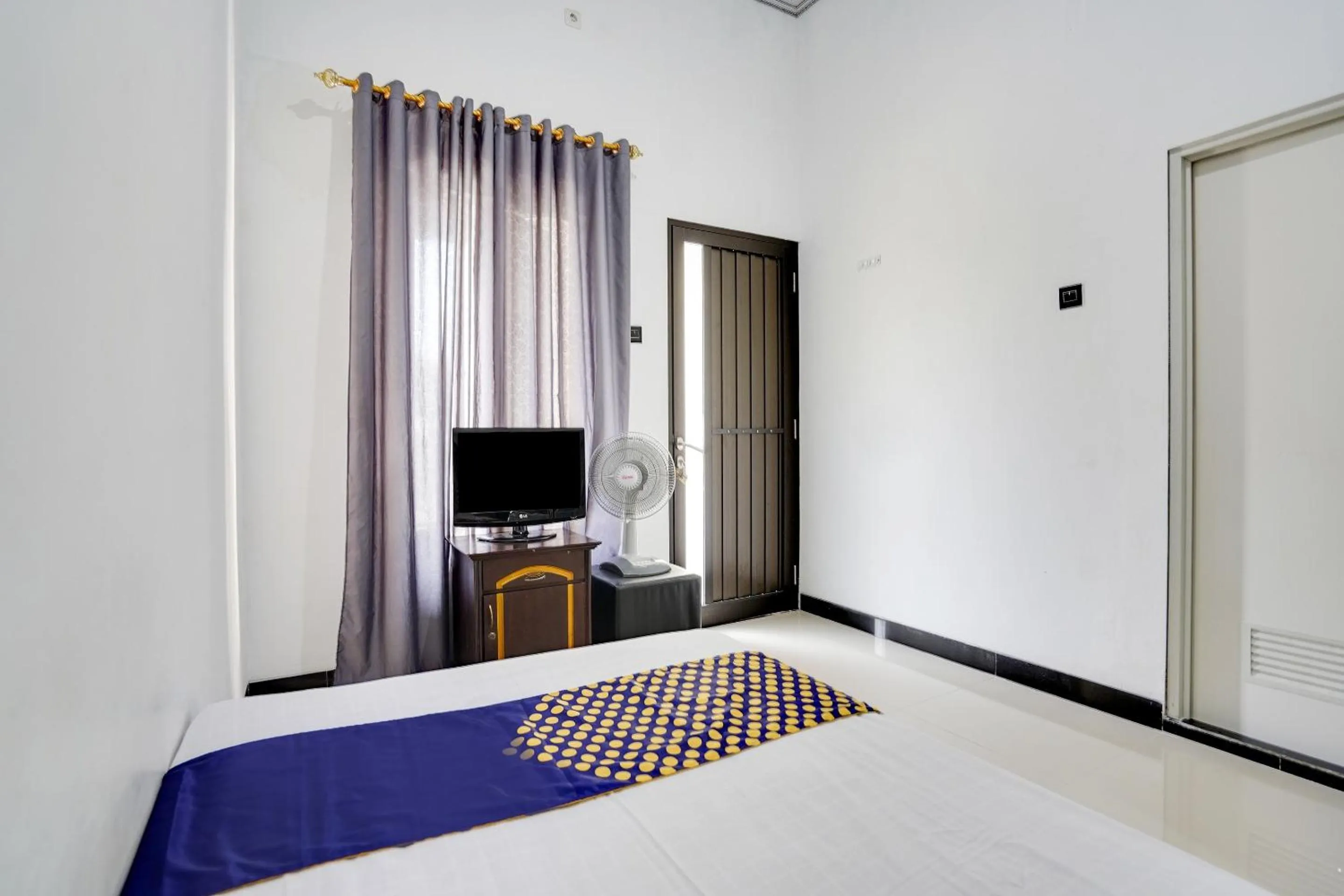 Bedroom in Hotel O Rumah Kost Gresik Syariah