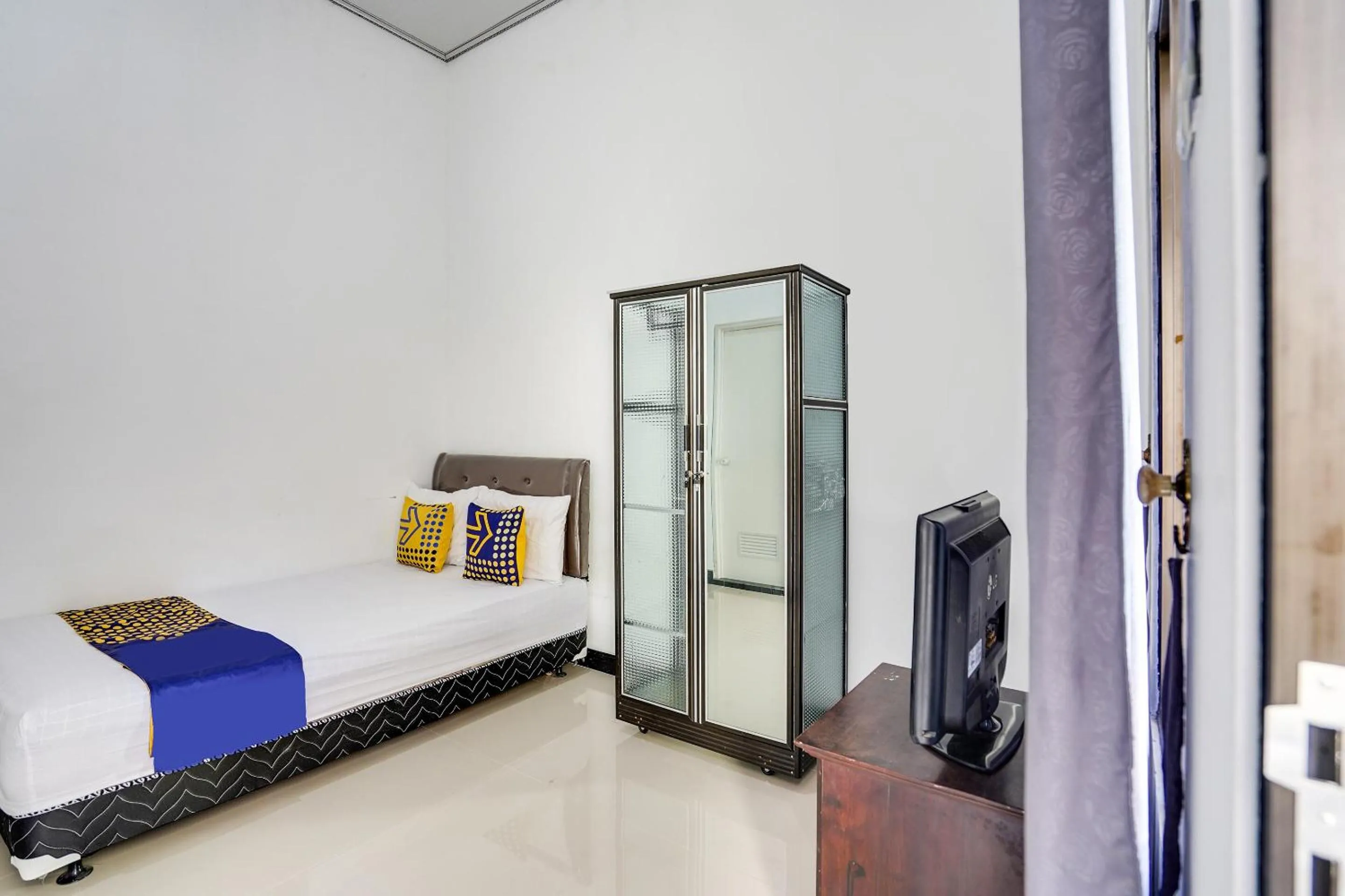 Bedroom in Hotel O Rumah Kost Gresik Syariah