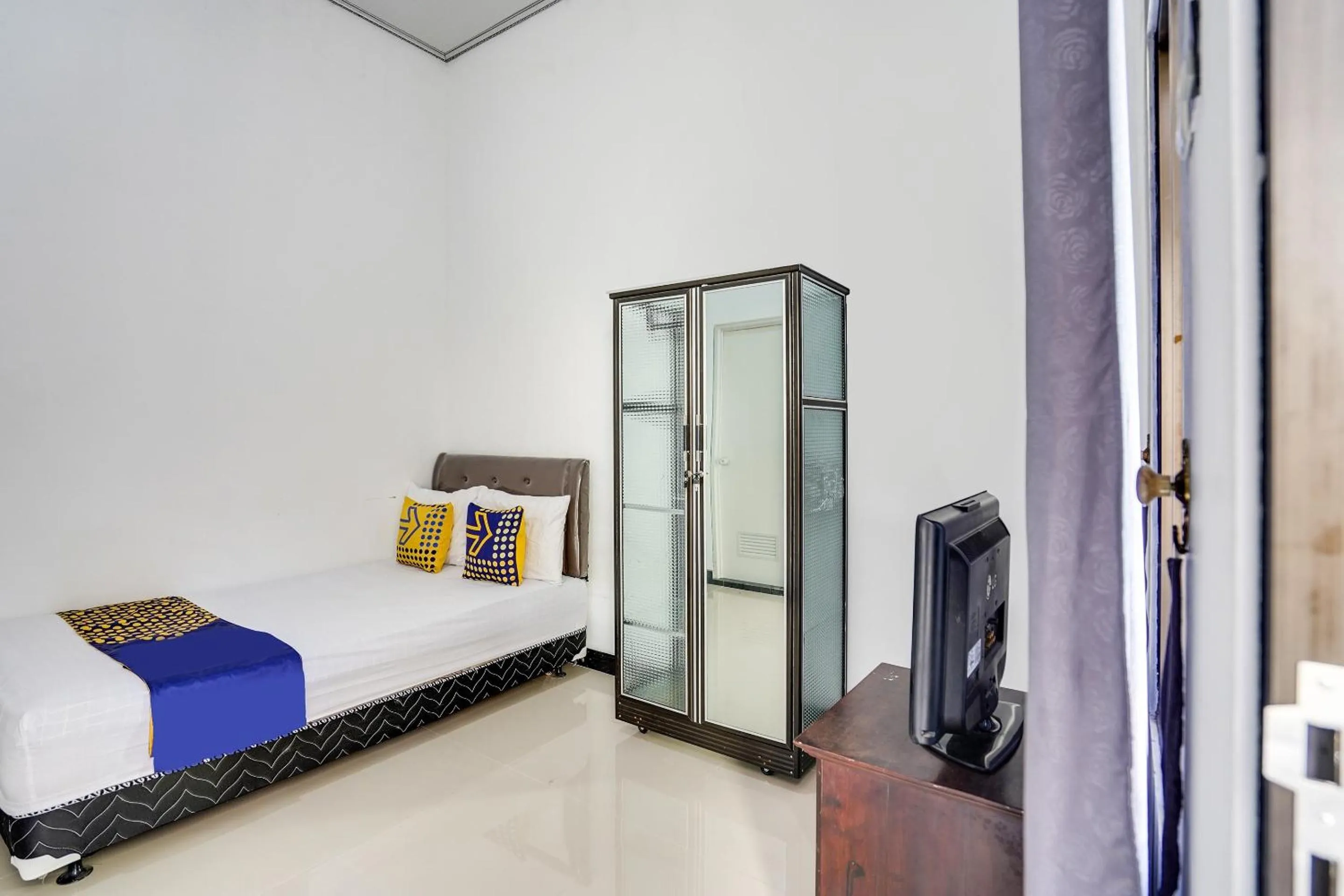 Bedroom in Hotel O Rumah Kost Gresik Syariah