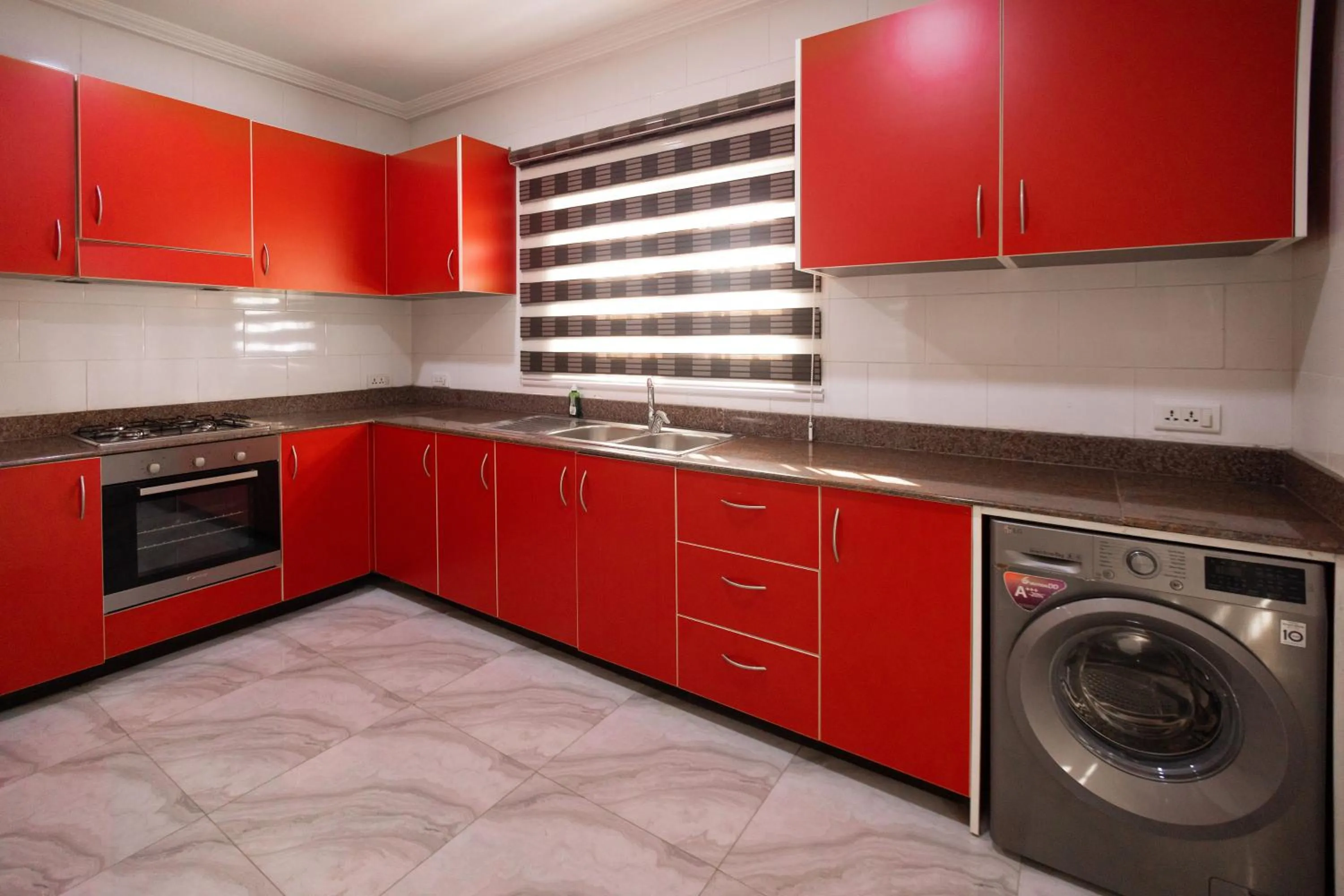 kitchen in Bragha Apartments And Hotel