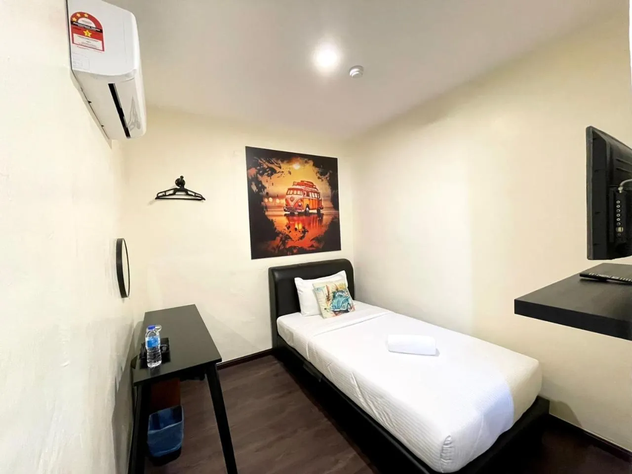 Bed in RNK BoutiQue HOTEL