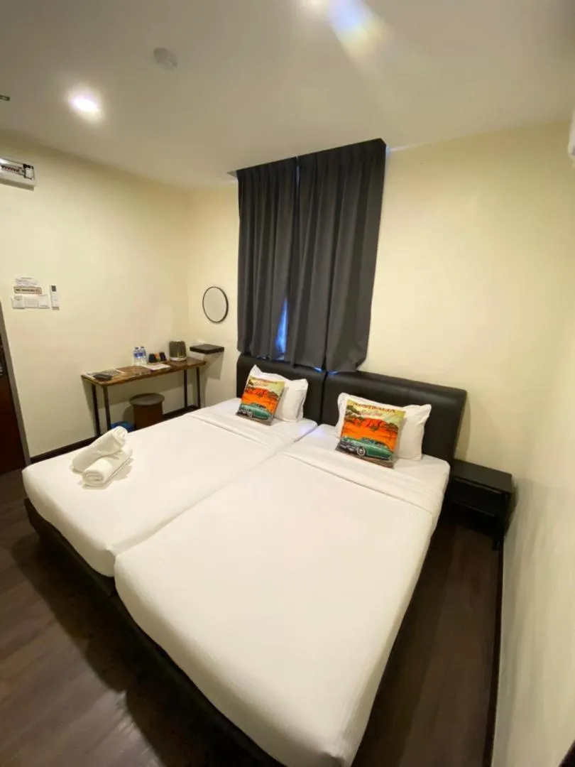 Bed in RNK BoutiQue HOTEL