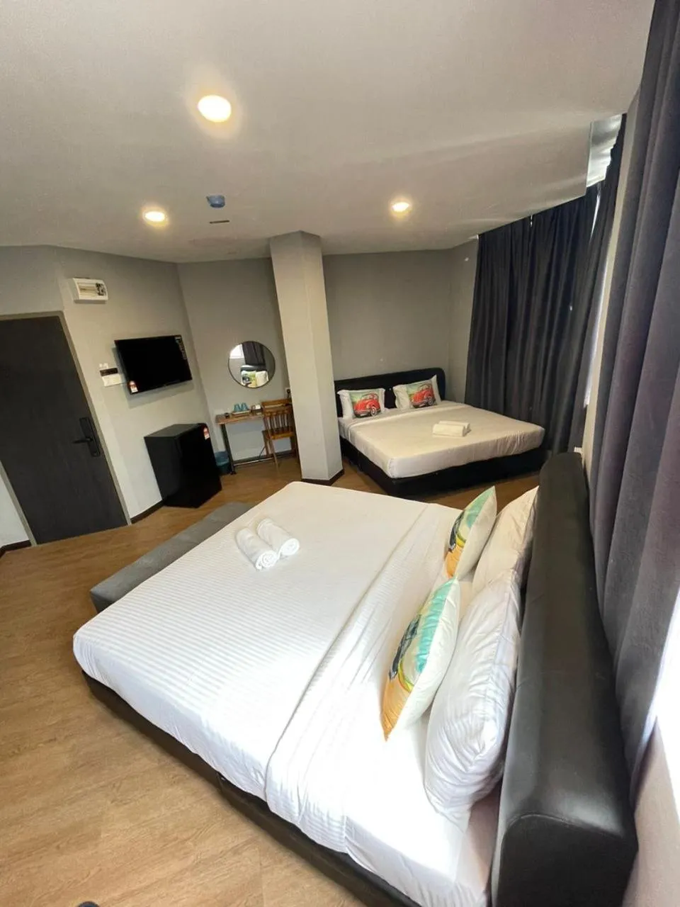 Bed in RNK BoutiQue HOTEL