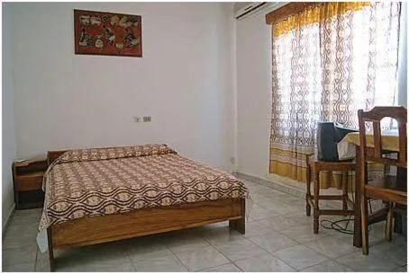 Photo of the whole room, Bed in Hotel Aurore Lomé