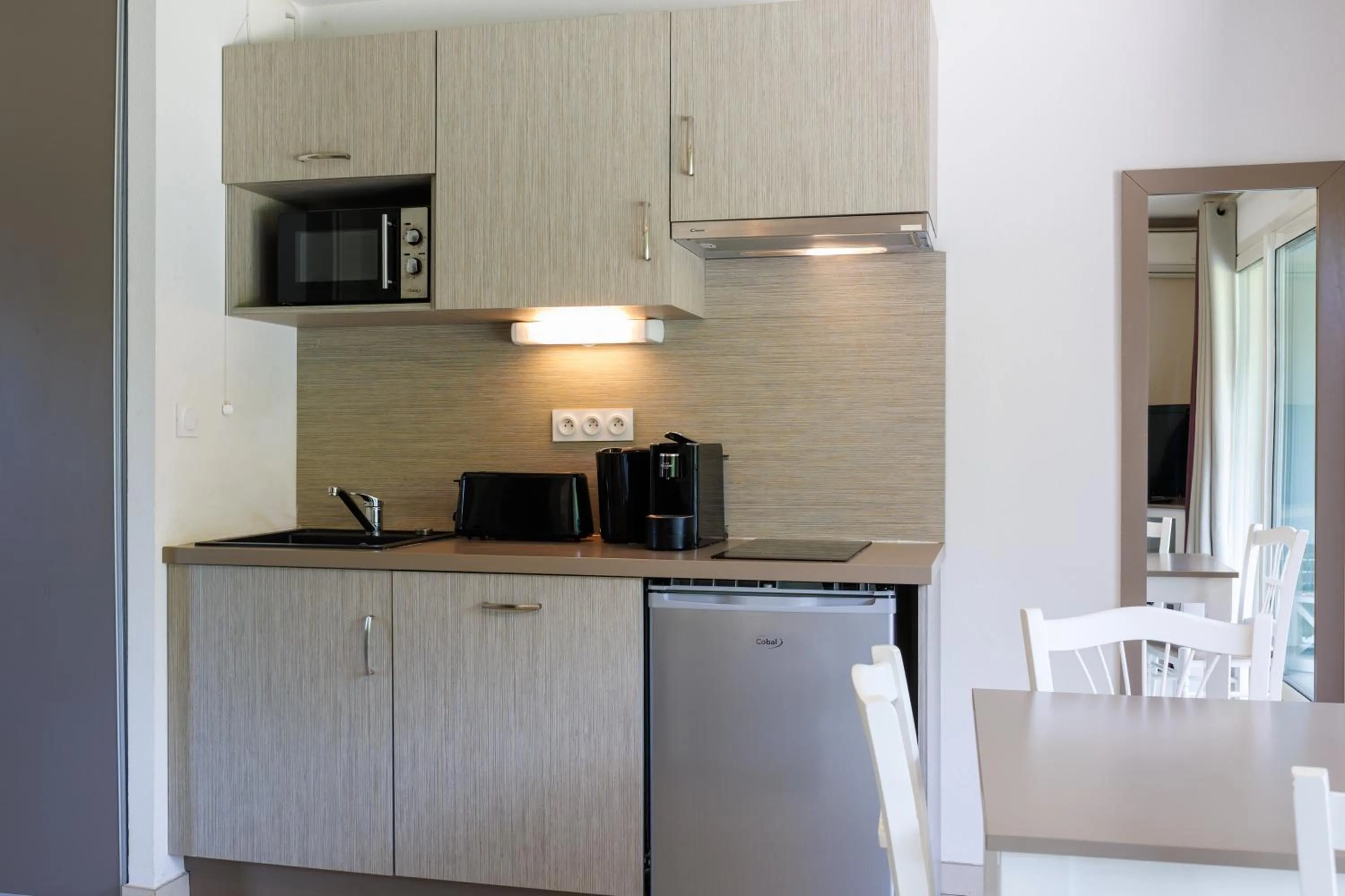 Kitchen or kitchenette in Residhotel Résidence Pont du Gard