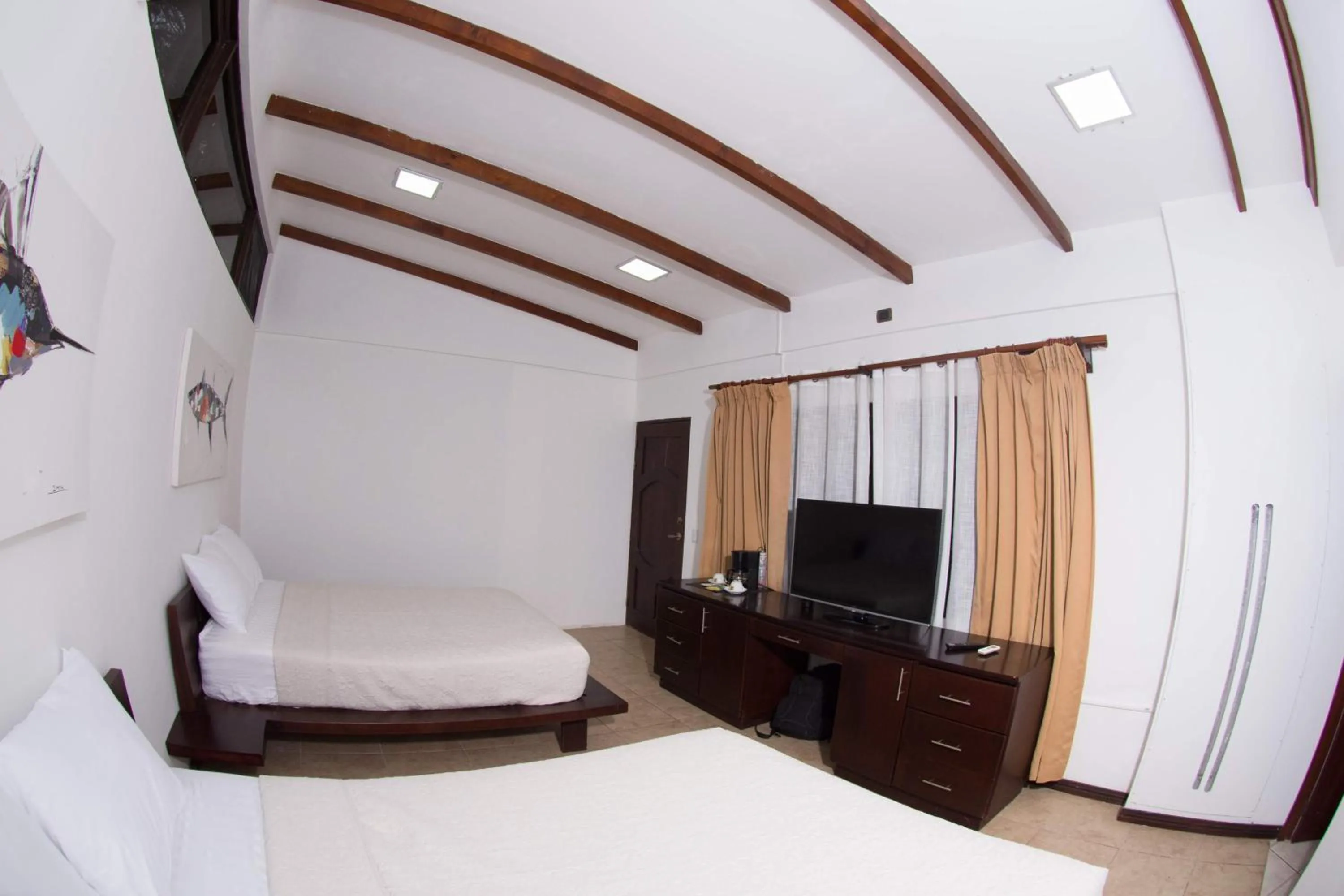 Bedroom in Café de Playa Beach Front Hotel