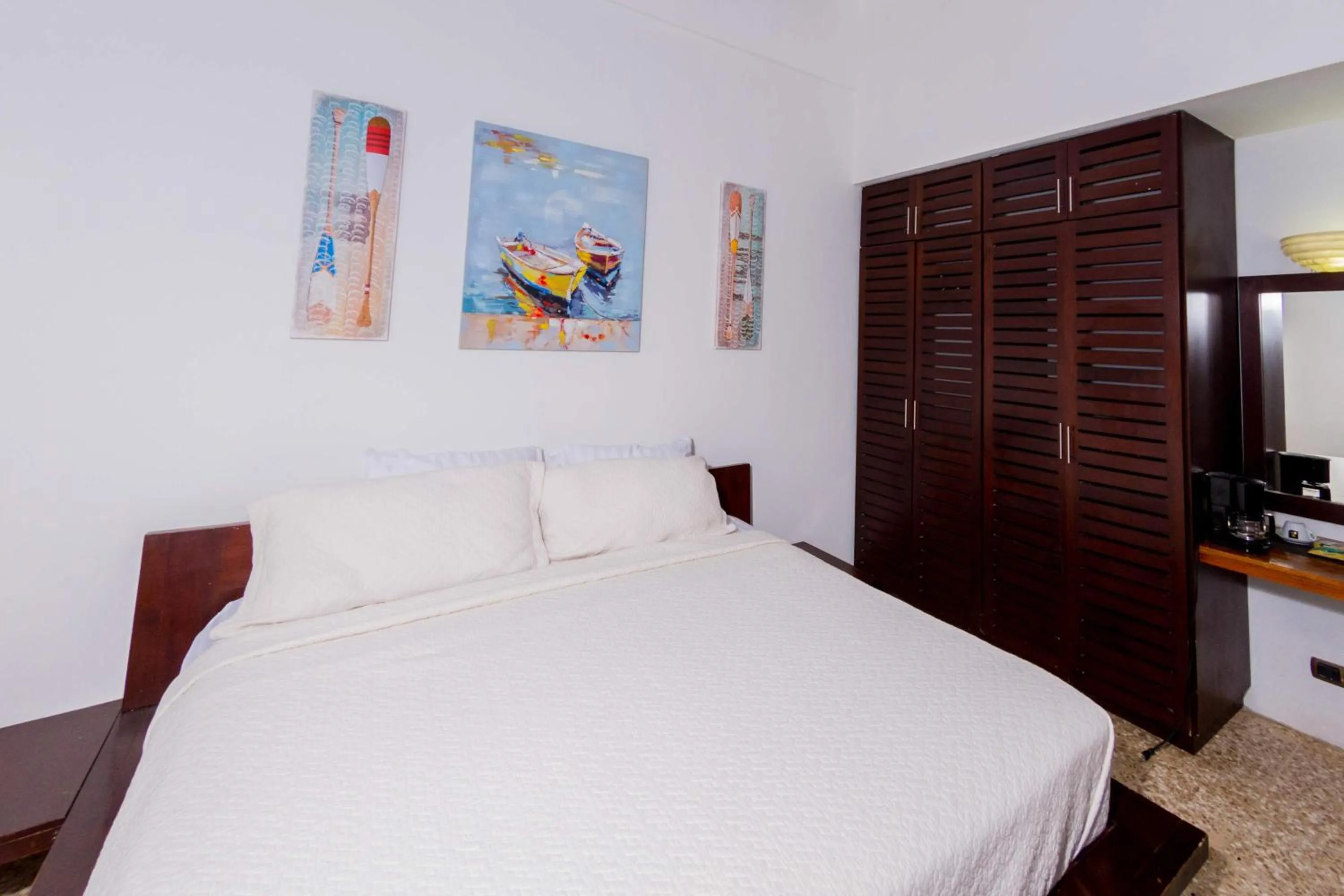 Bedroom in Café de Playa Beach Front Hotel