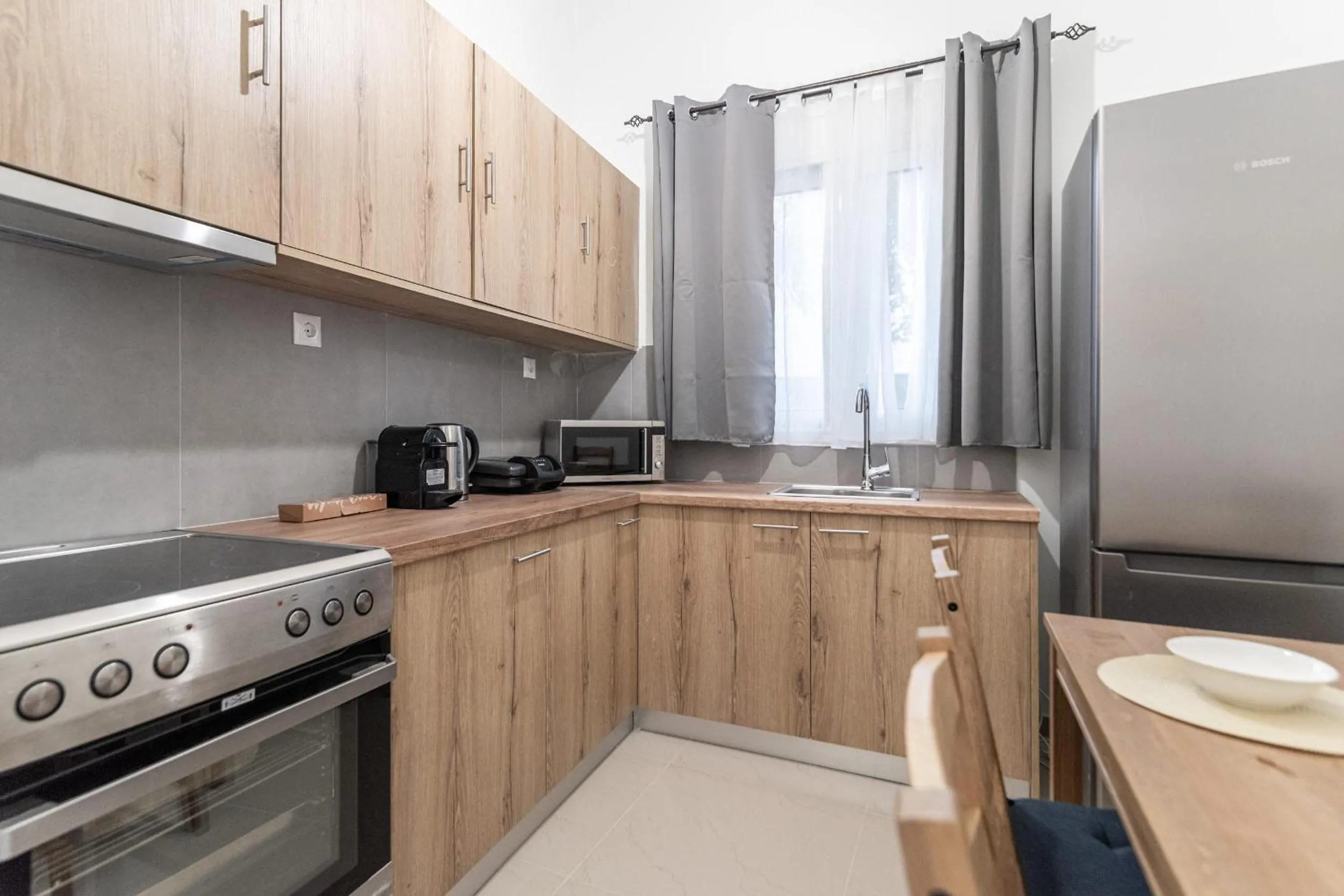 Kitchen or kitchenette in Blue Riviera villas & suites - Alimos 2