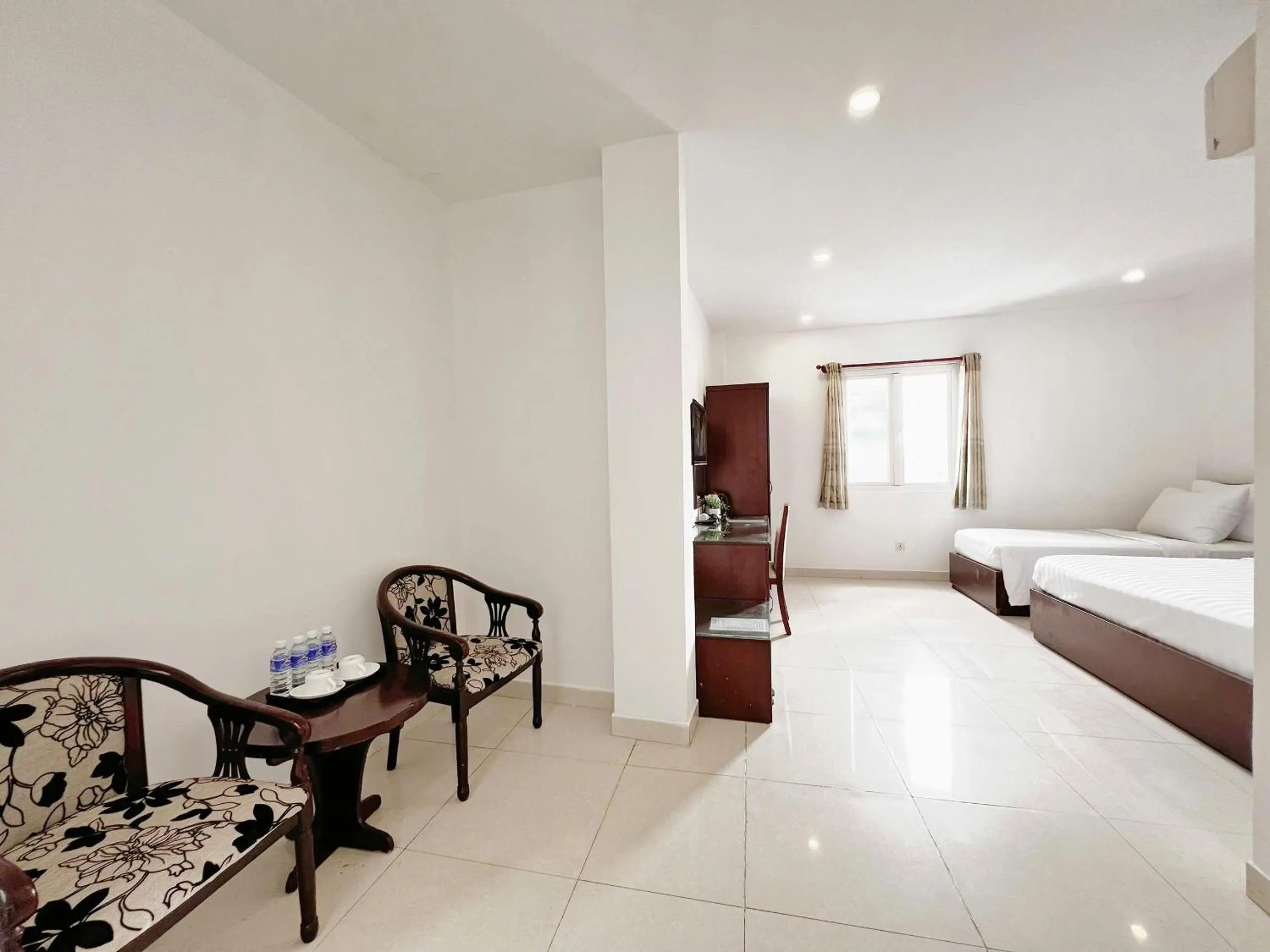 Living room, Bed in SaiGon Europe Hotel