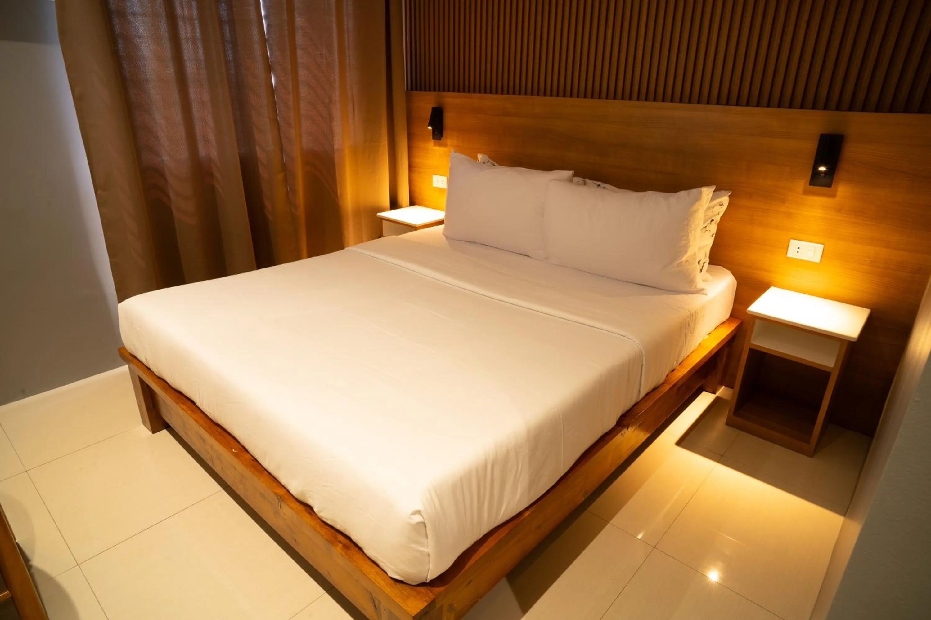 Bed in Madonna Hometel and Suites New Pandan