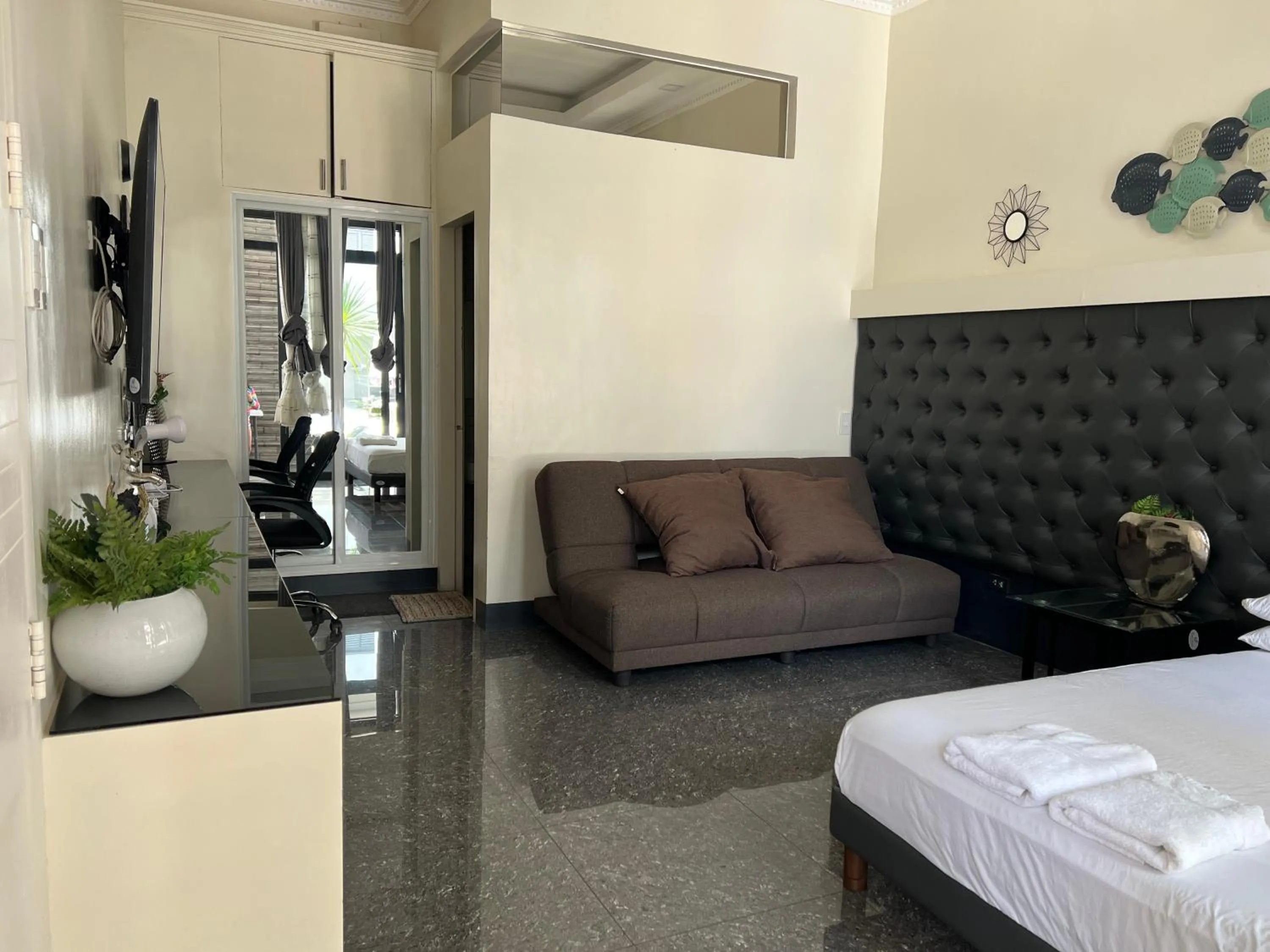 Seating area, Bed in Dampa Poolside Events & Accommodation