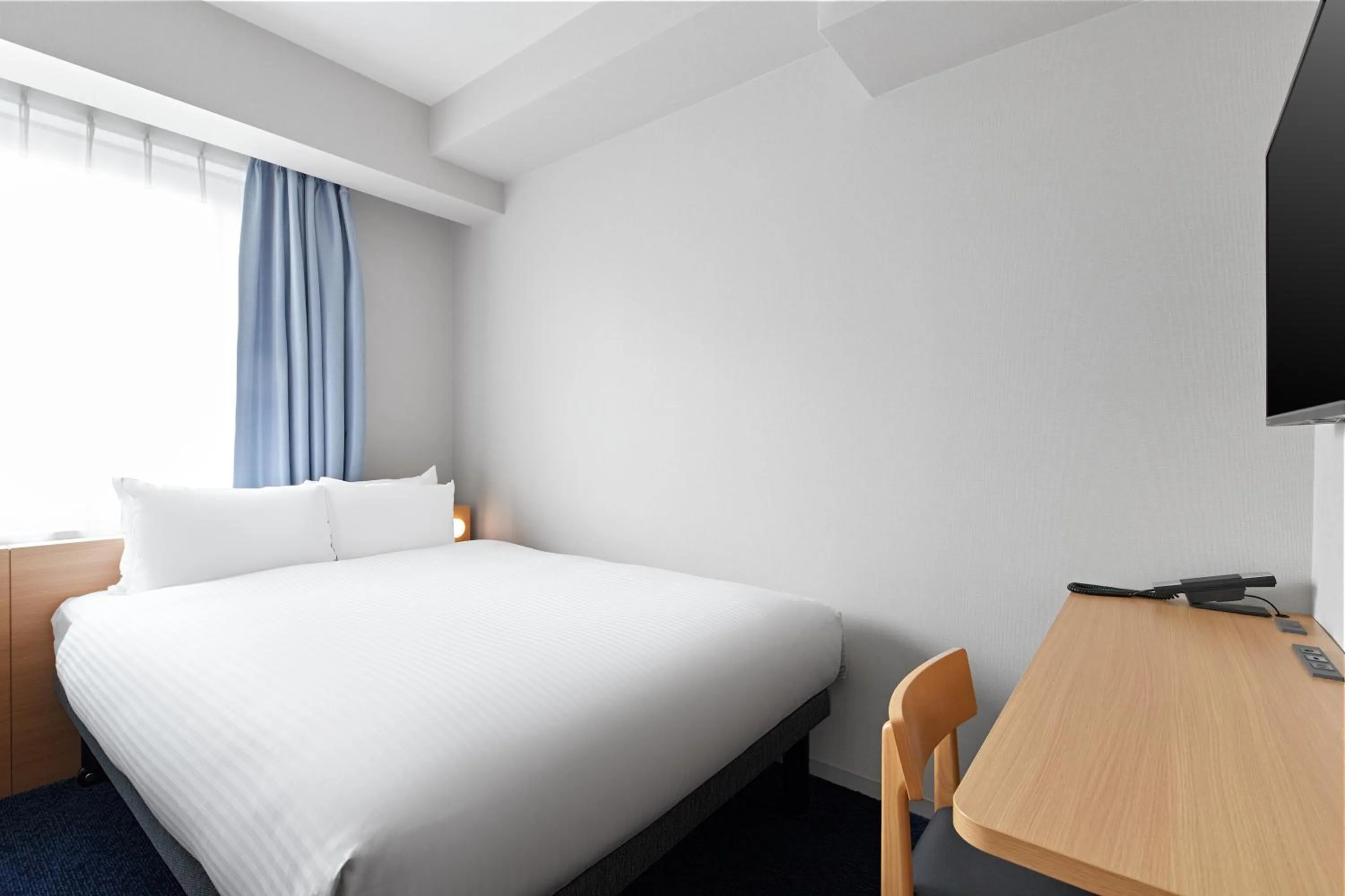 Photo of the whole room, Bed in Sotetsu Fresa Inn Yodoyabashi