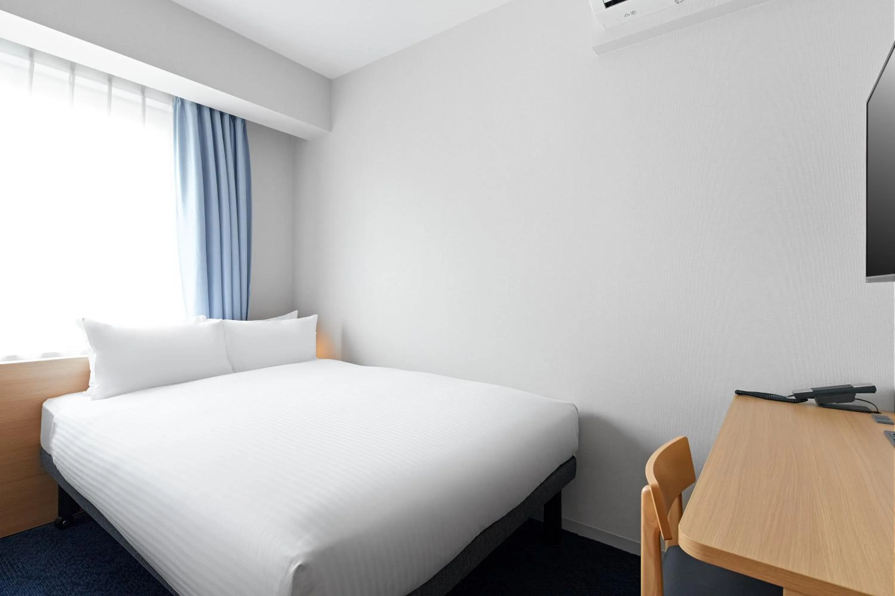 Photo of the whole room, Bed in Sotetsu Fresa Inn Yodoyabashi