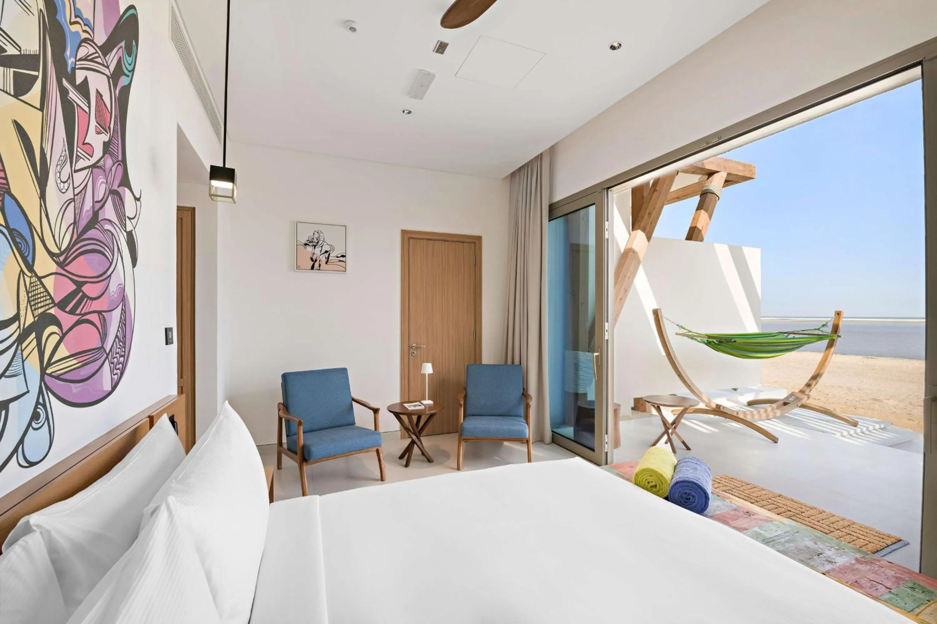 Living room, Bed in Fuwairit Kite Beach, Tapestry Collection By Hilton