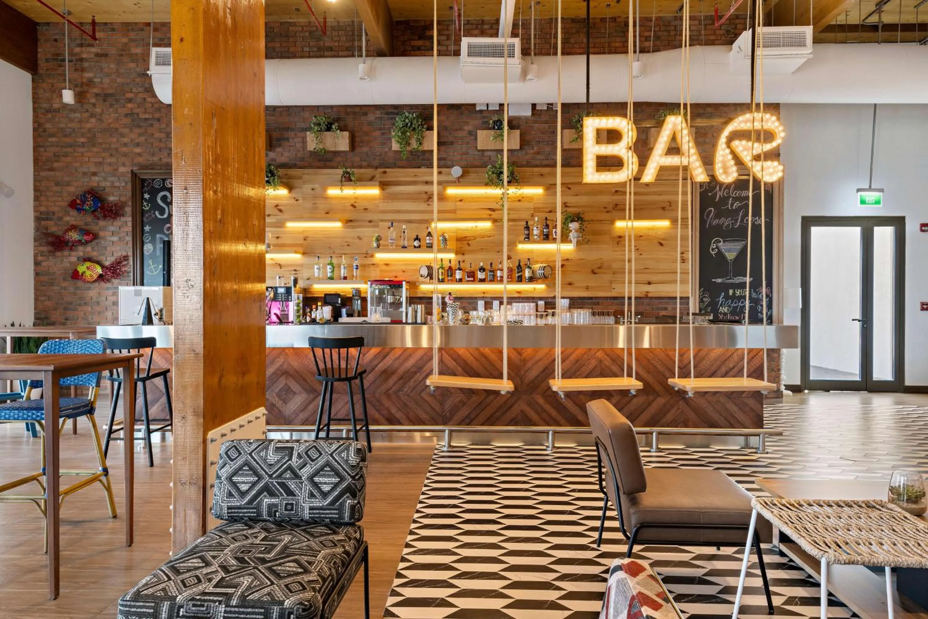 Lounge or bar in Fuwairit Kite Beach, Tapestry Collection By Hilton