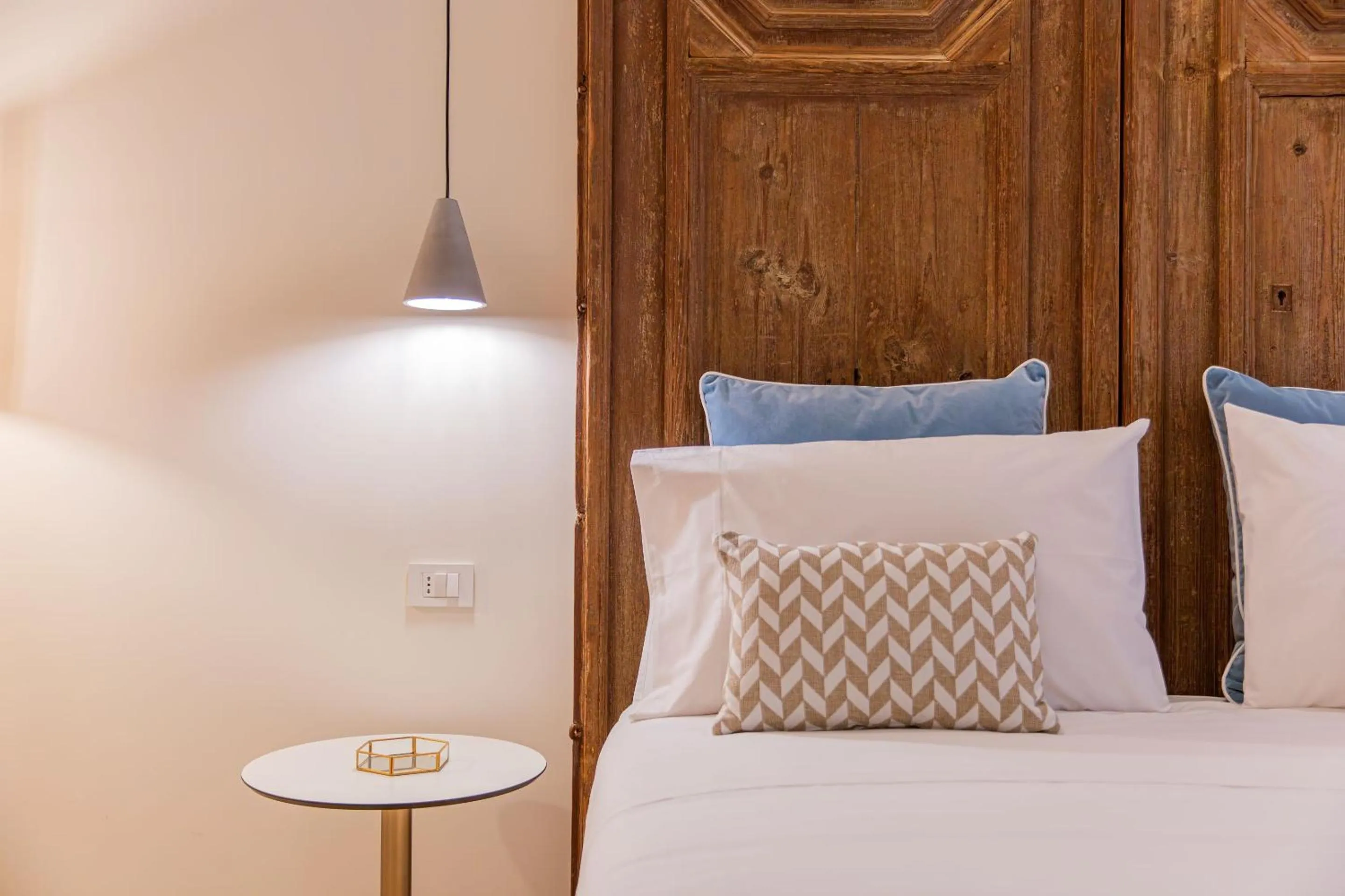 Bed in Costamante Suites & Spa