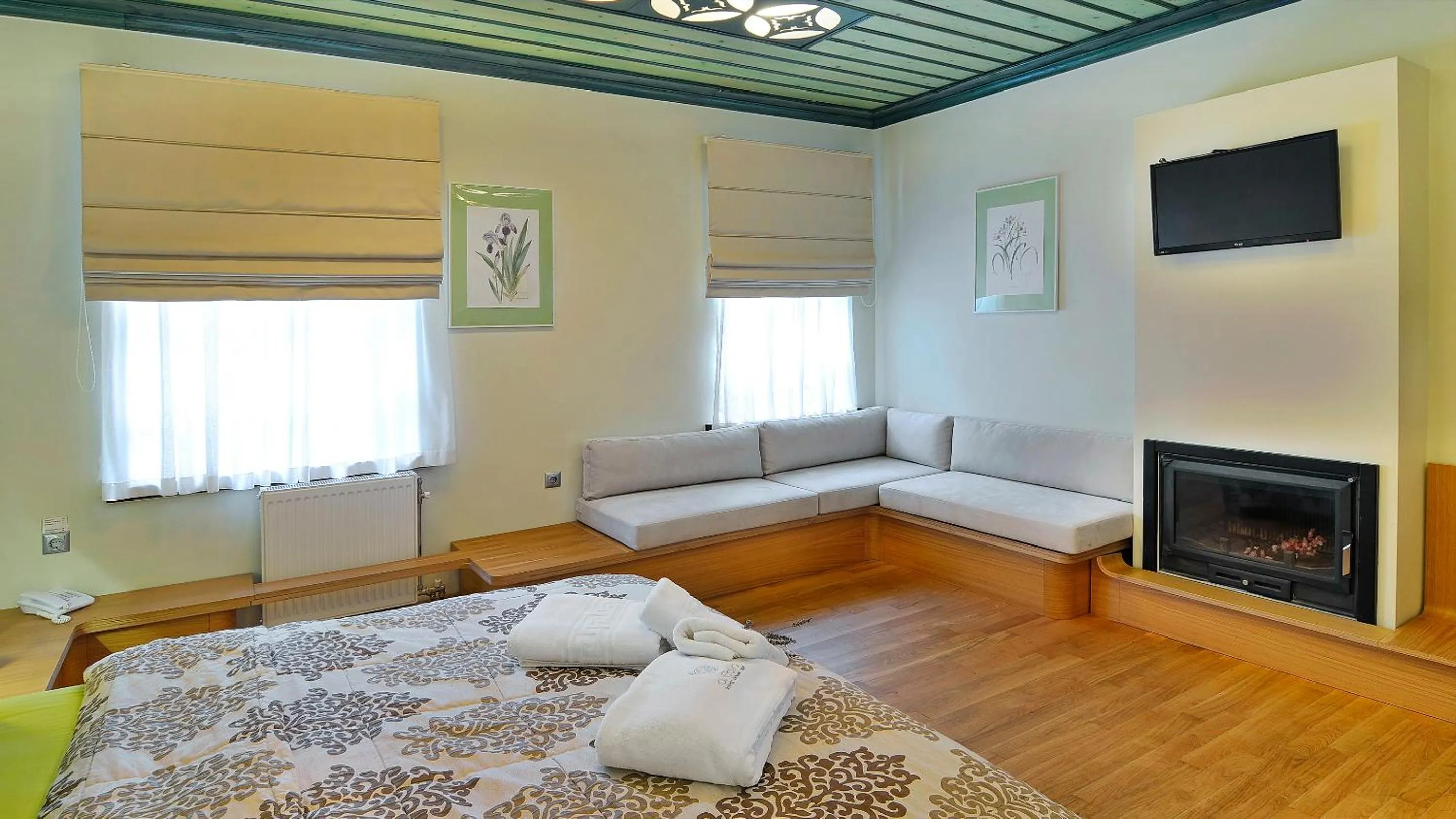 Seating area, Bed in Dilofo Hotel Luxury Suites