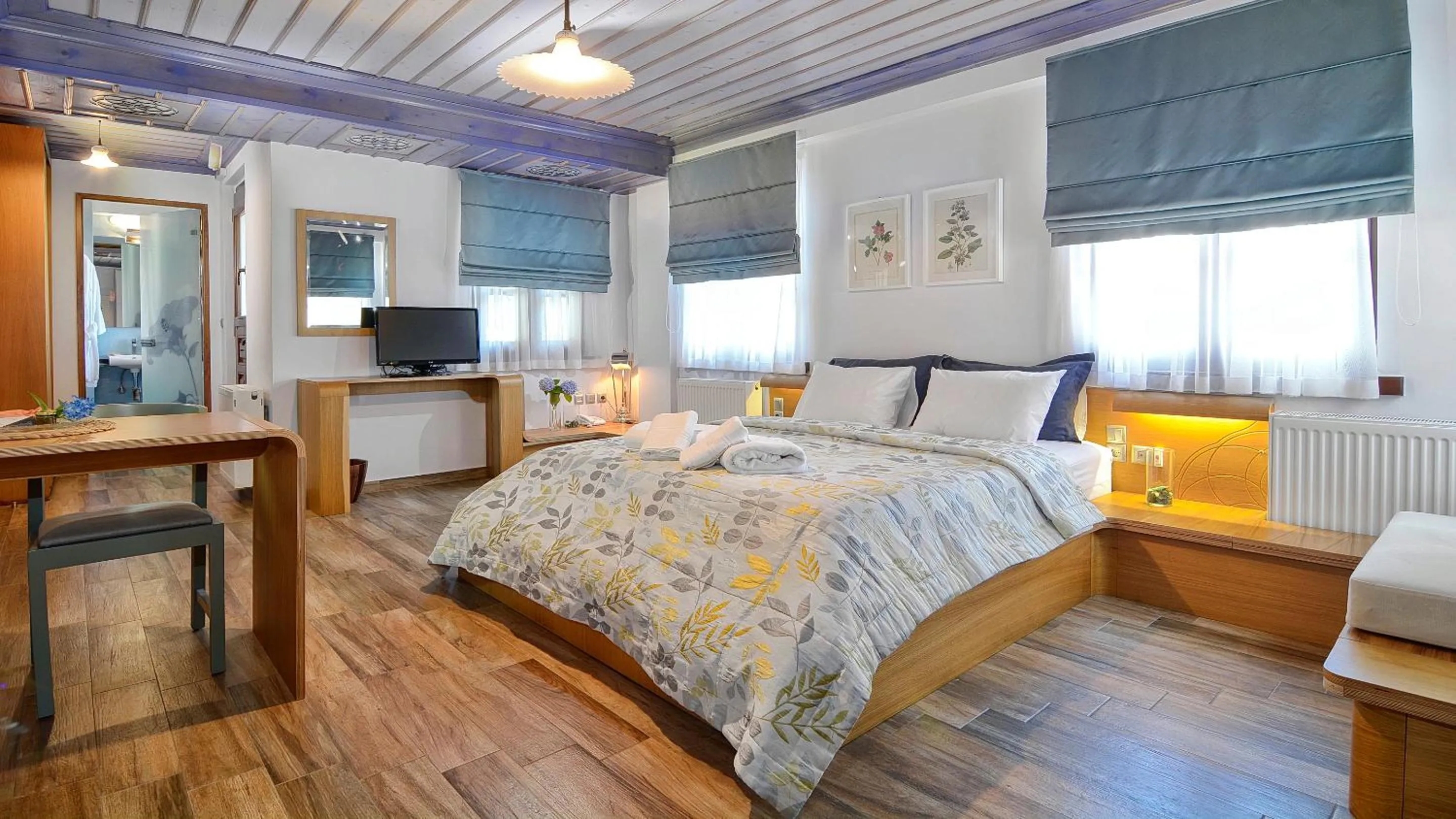 Bed in Dilofo Hotel Luxury Suites