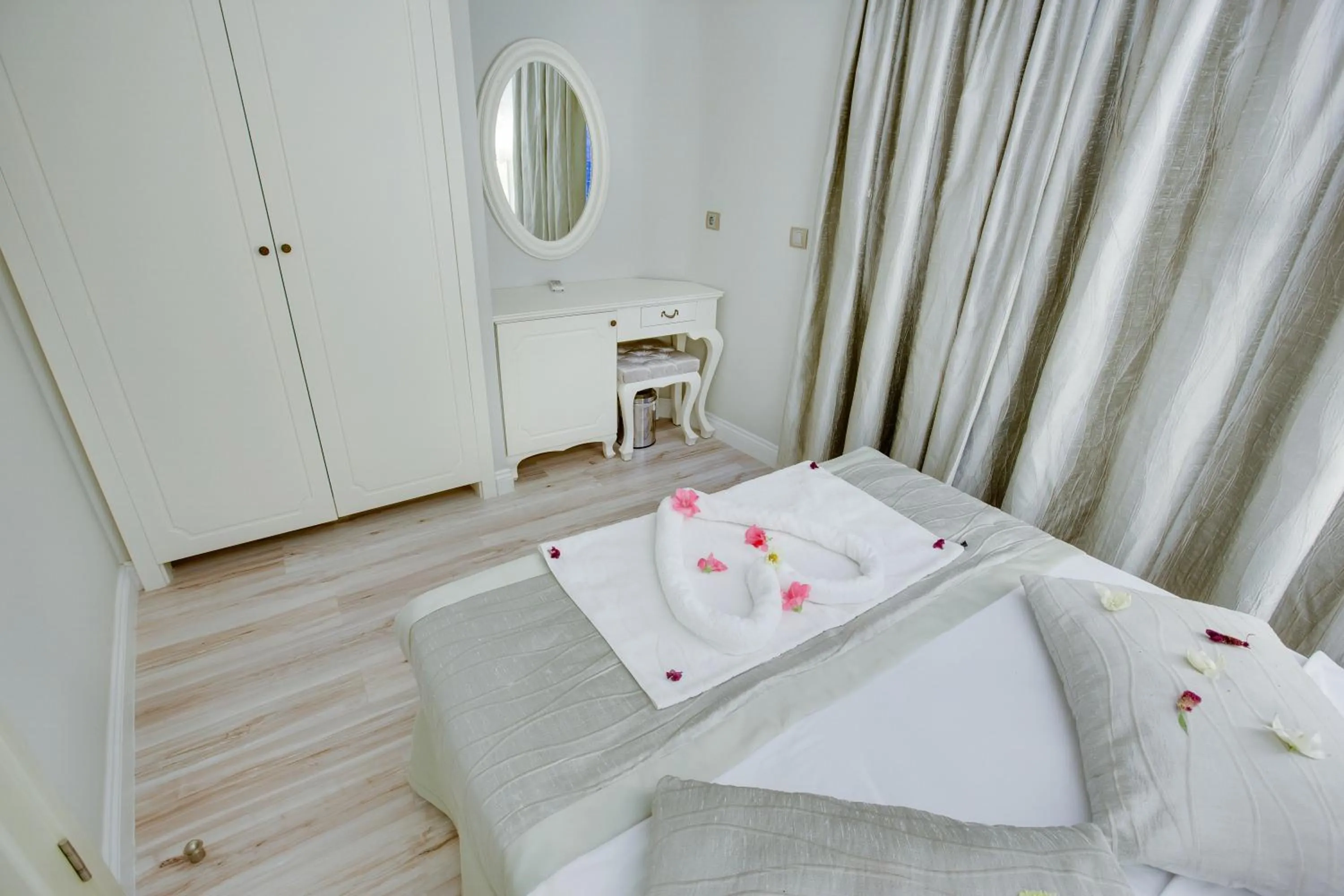 Bed in Pinehill Hotel & Suites