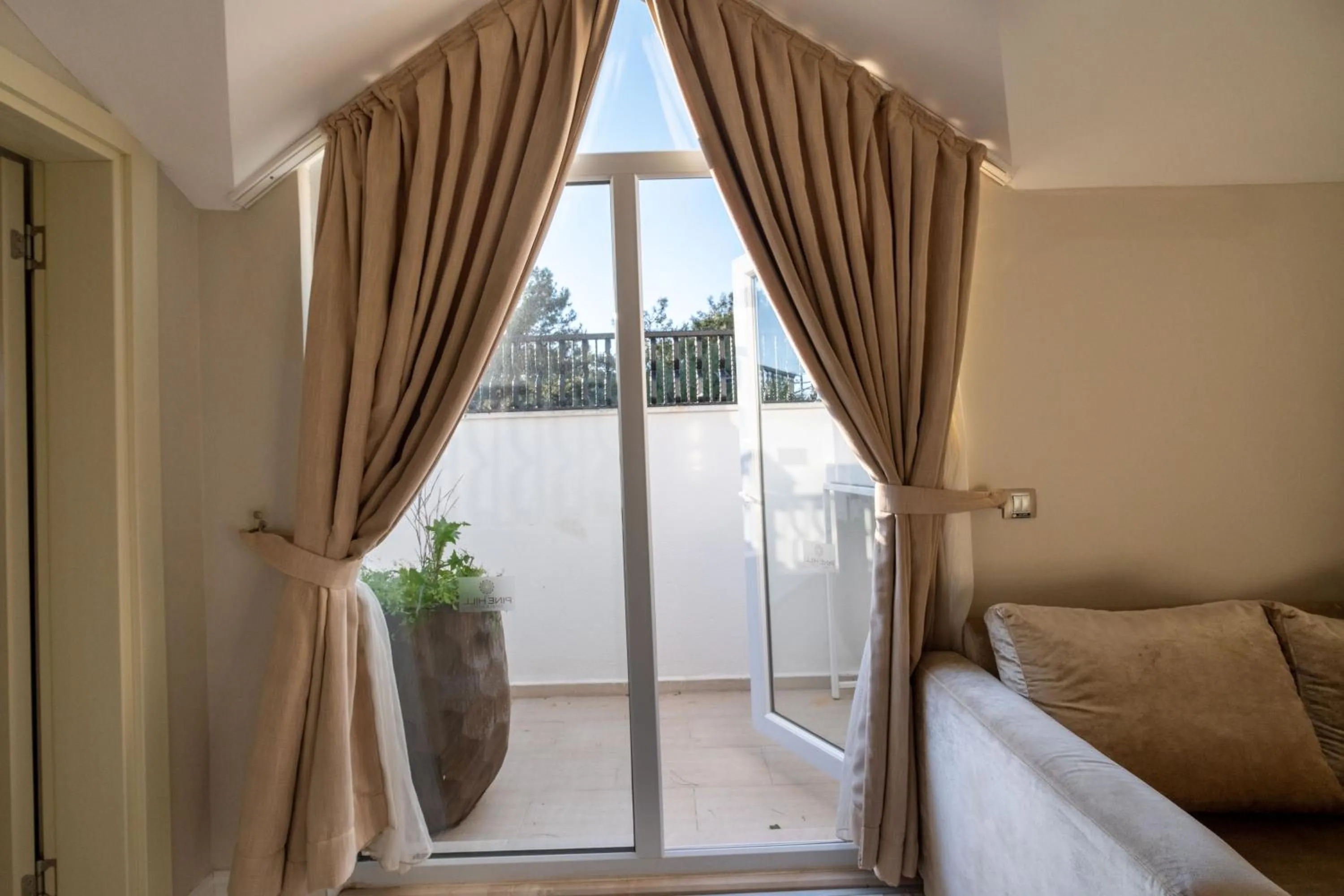 Bed in Pinehill Hotel & Suites