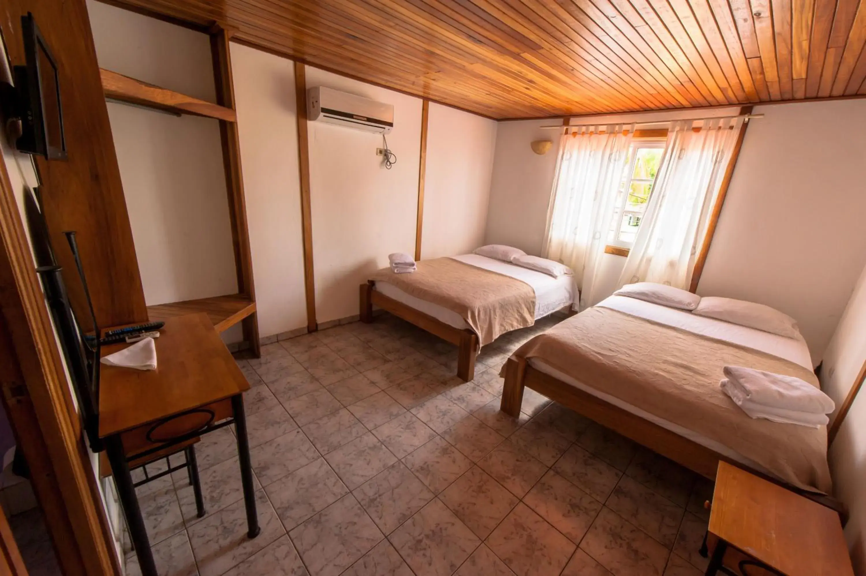 Quadruple Room with Balcony in Hotel Posada Los Delfines Quadruple Room with Balcony in Hotel Posada Los Delfines