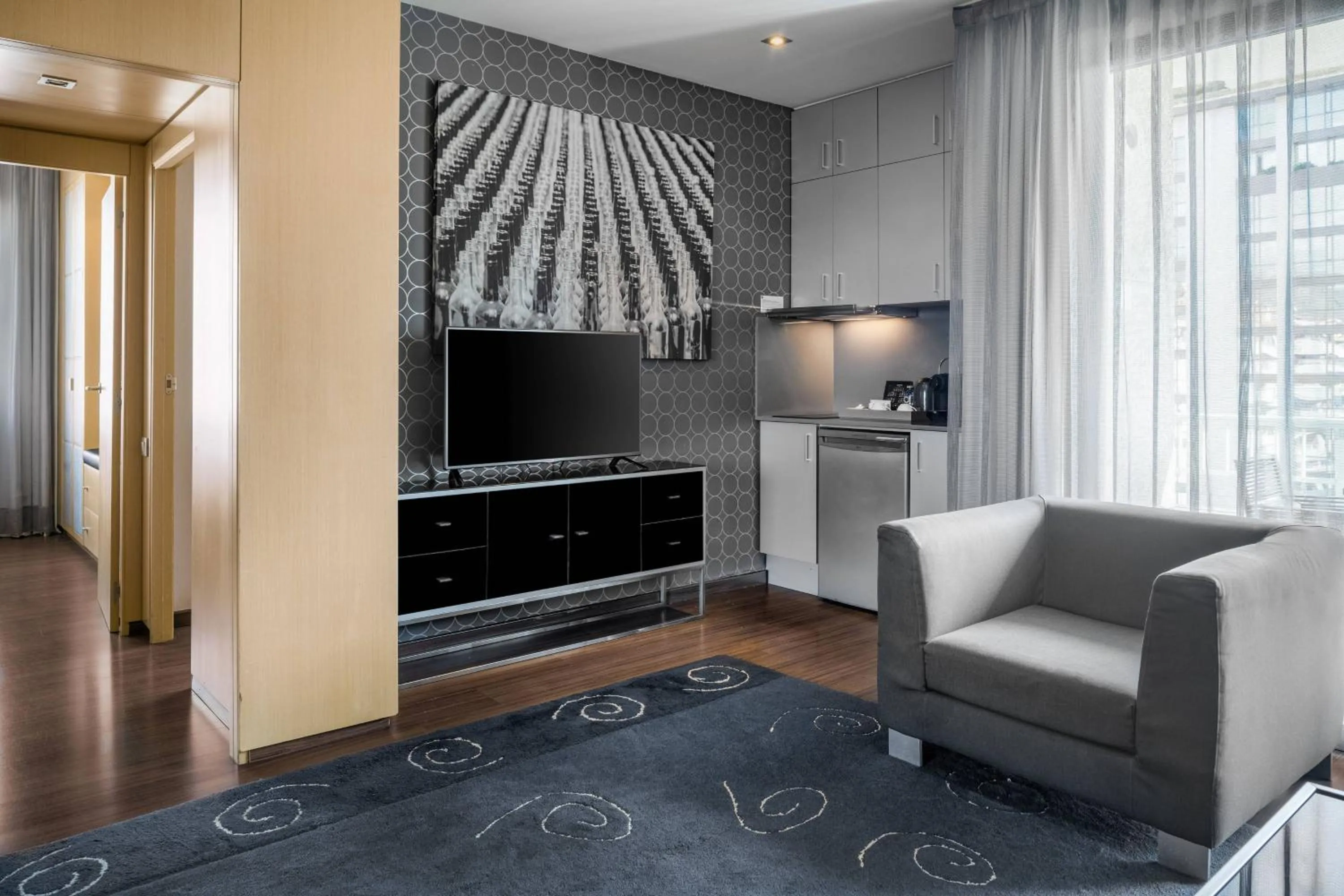 Living room in AC Hotel Victoria Suites by Marriott