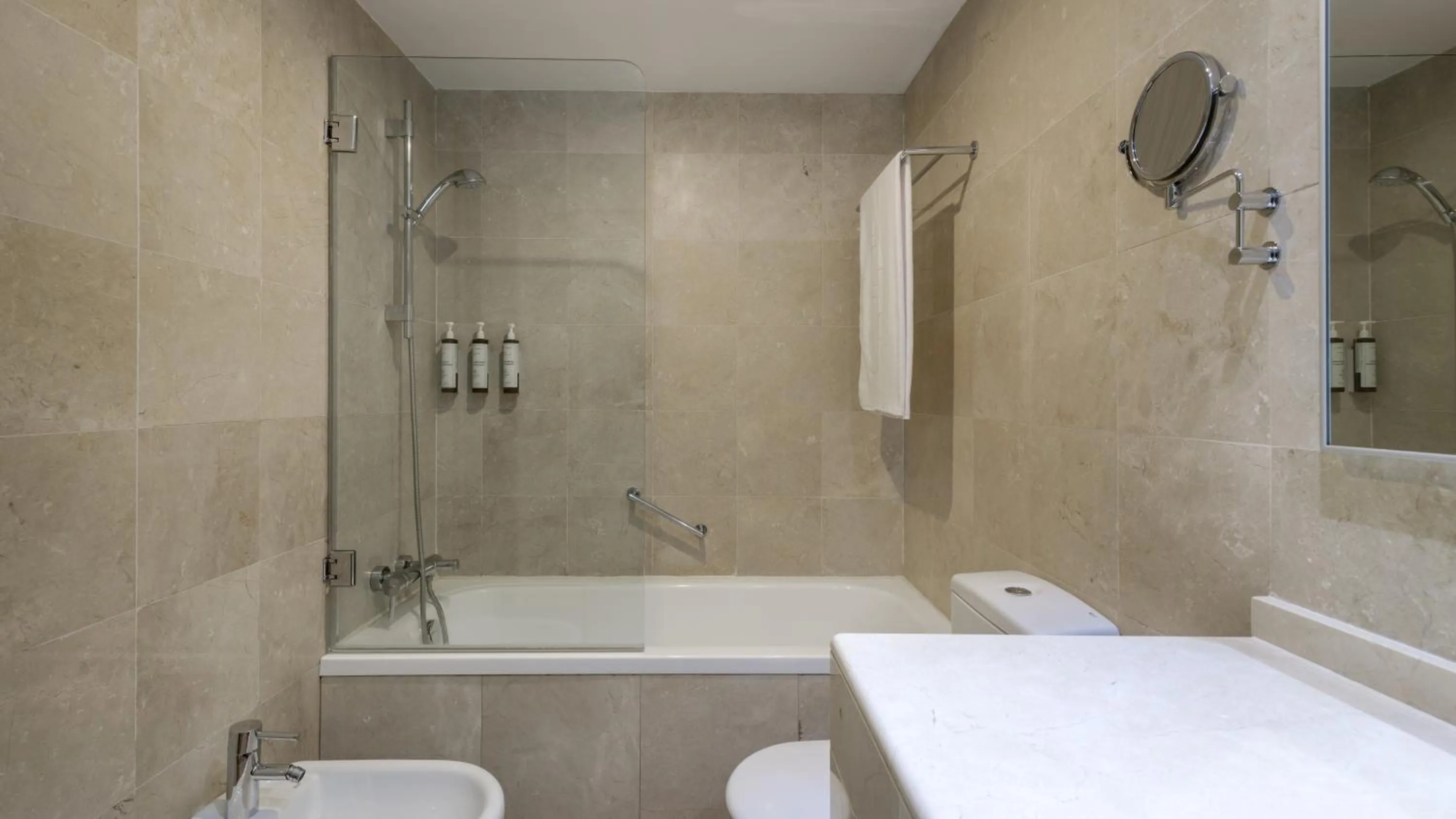 Bathroom in AC Hotel Victoria Suites by Marriott