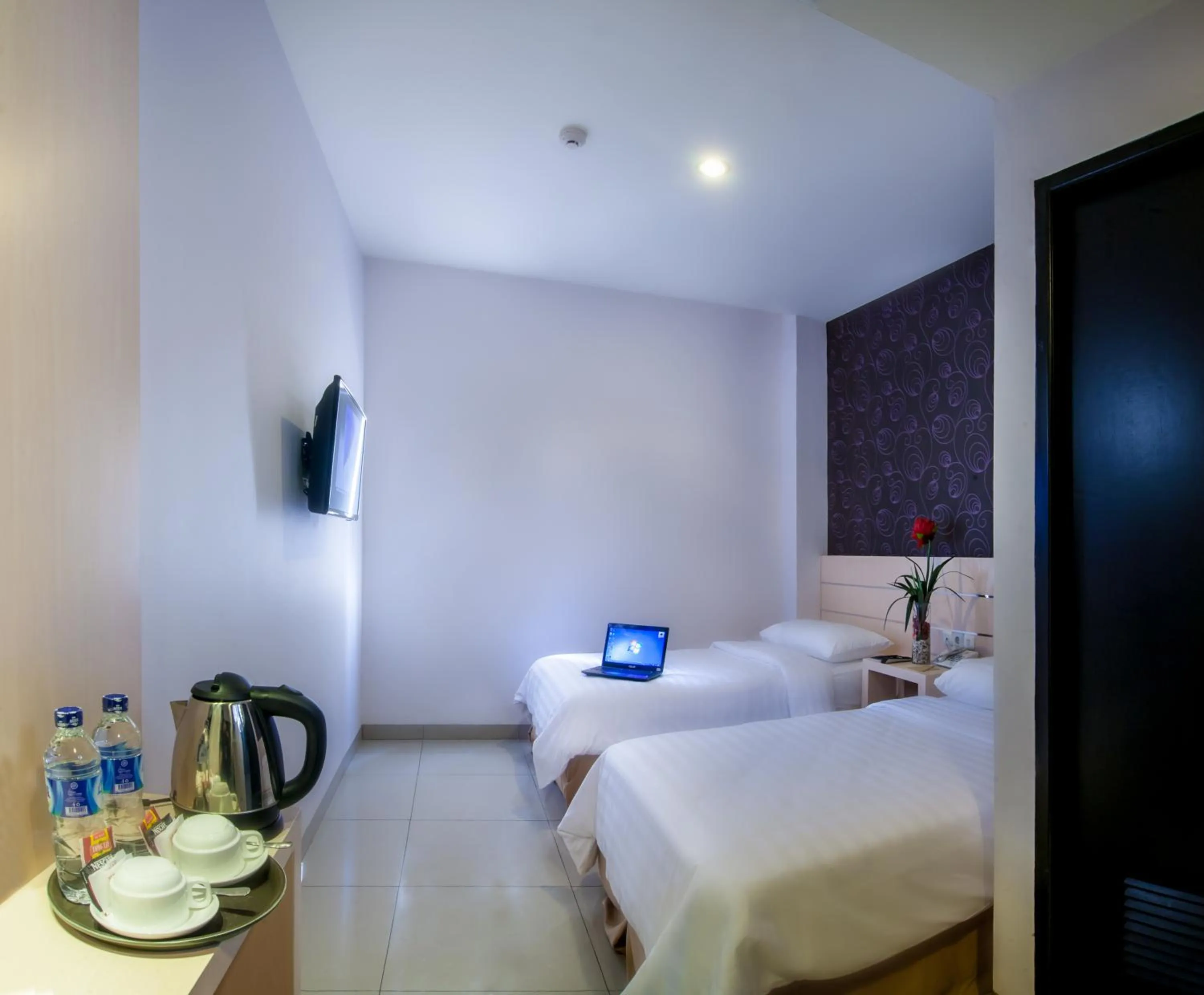 Photo of the whole room, Bed in Cordela Hotel Medan