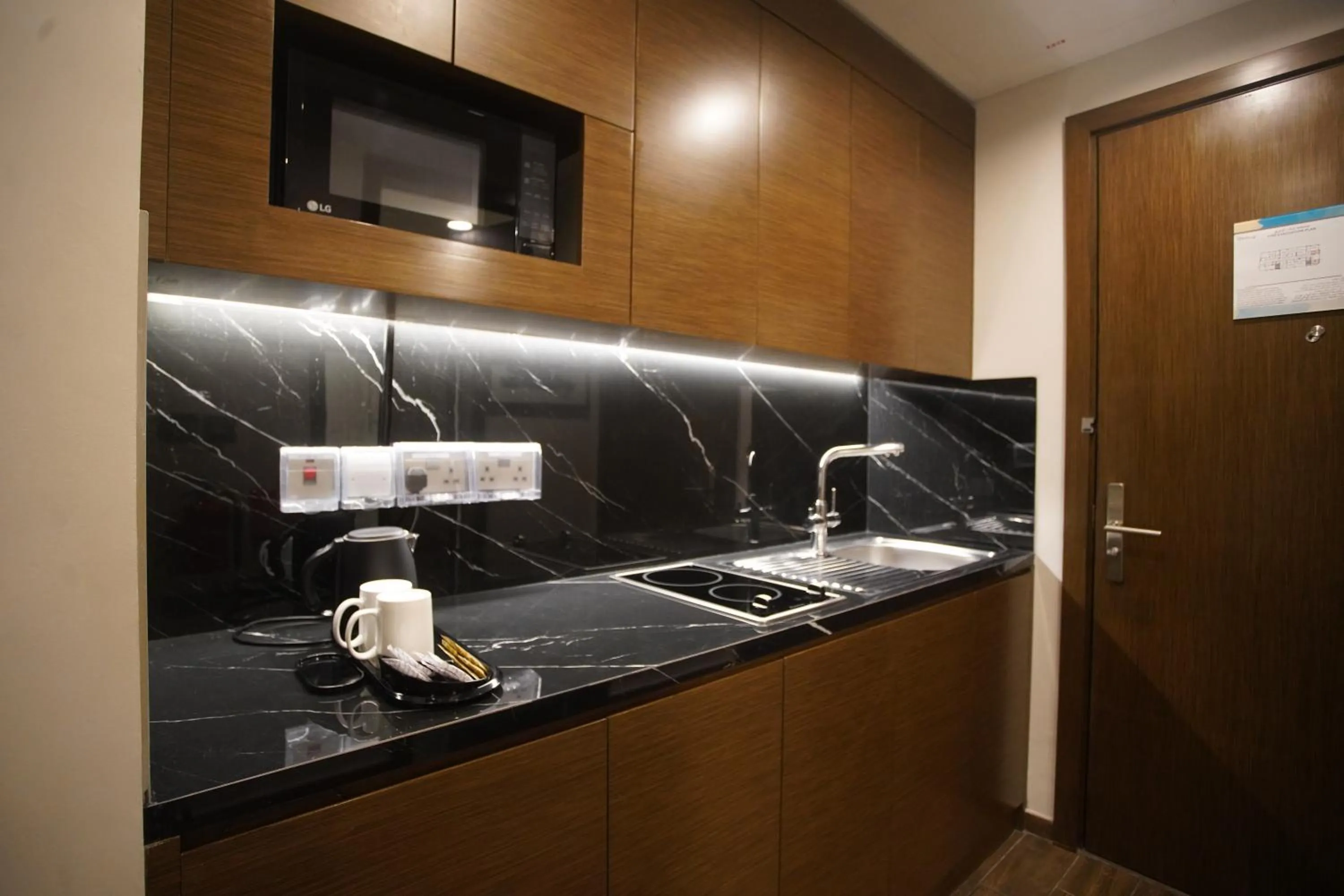 Kitchen or kitchenette in C - Hotel and Suites Doha