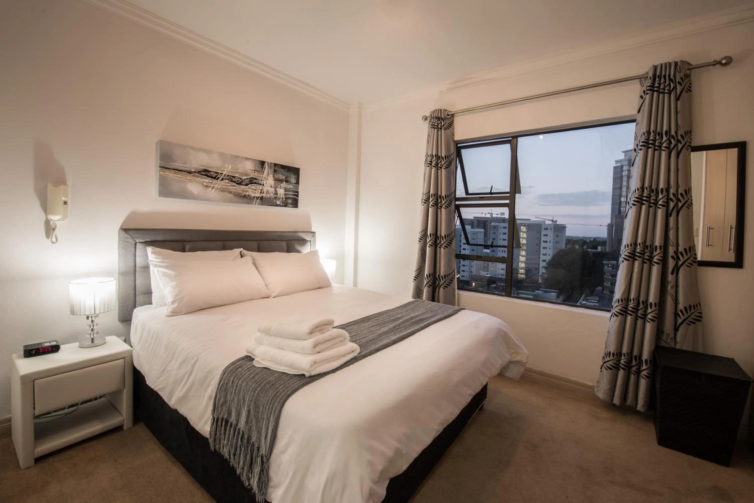 Photo of the whole room, Bed in Prestige Apartments Sandton at Westpoint