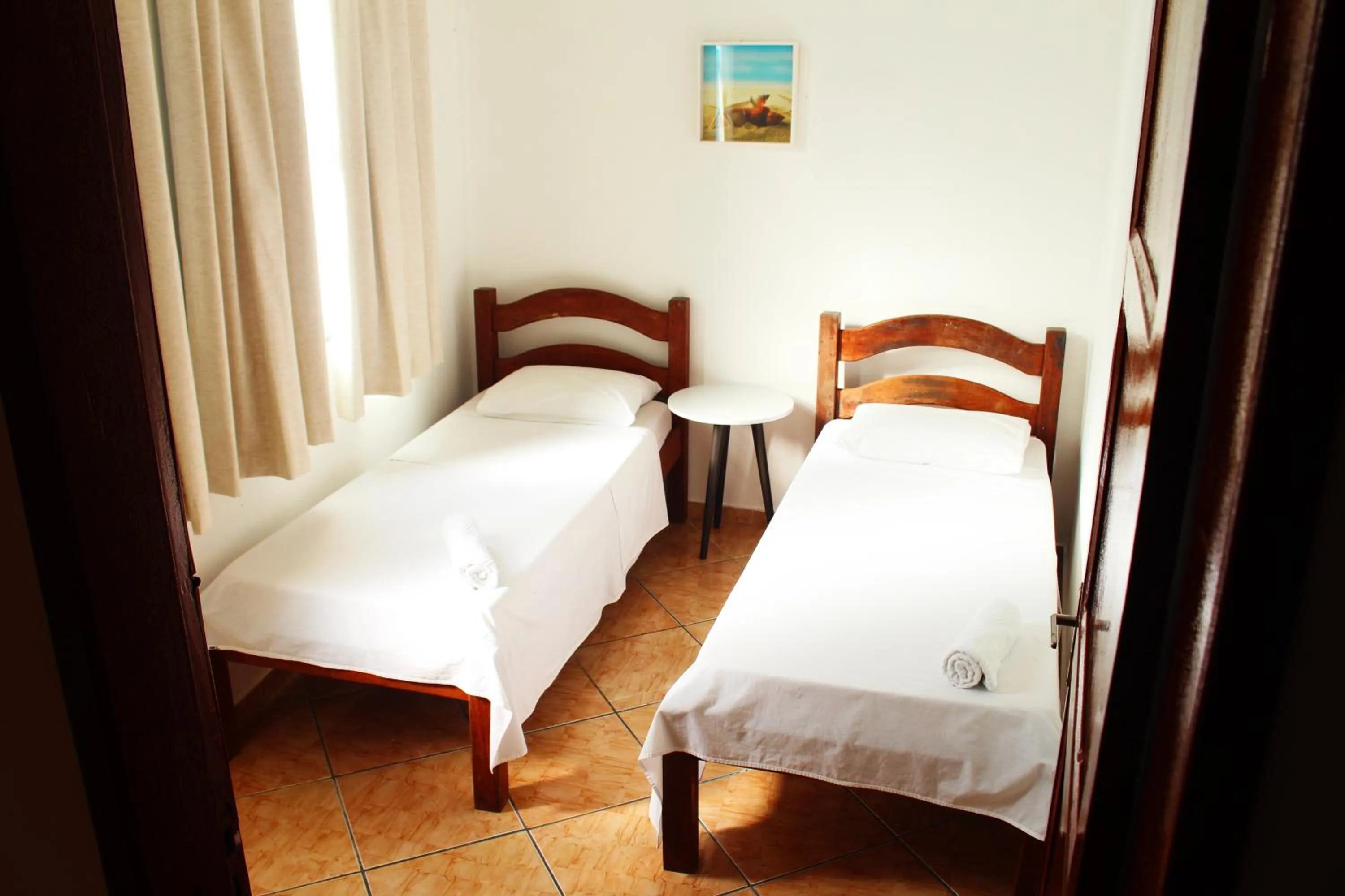 Bed in Tamboleiro's Hotel Residence