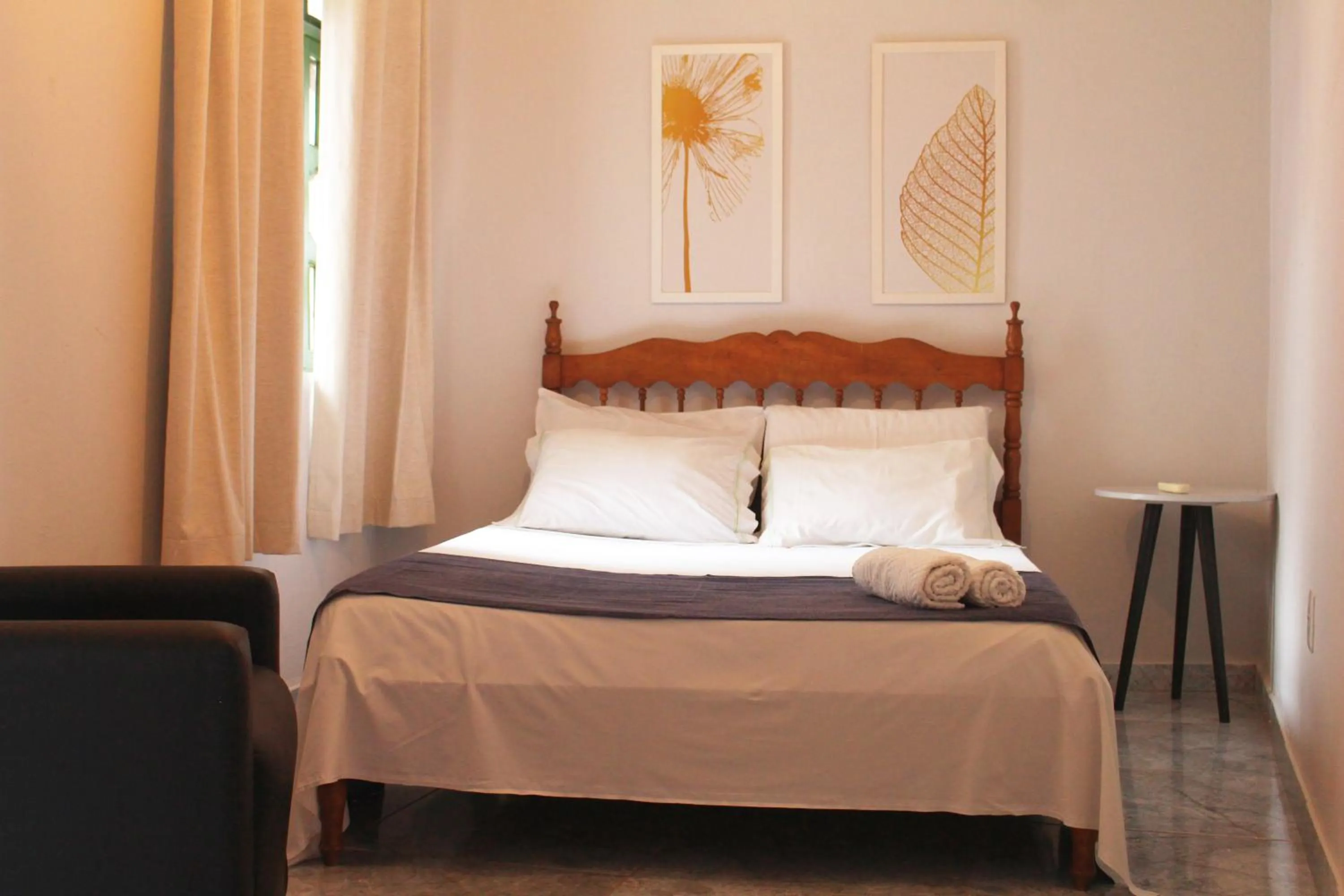 Bed in Tamboleiro's Hotel Residence