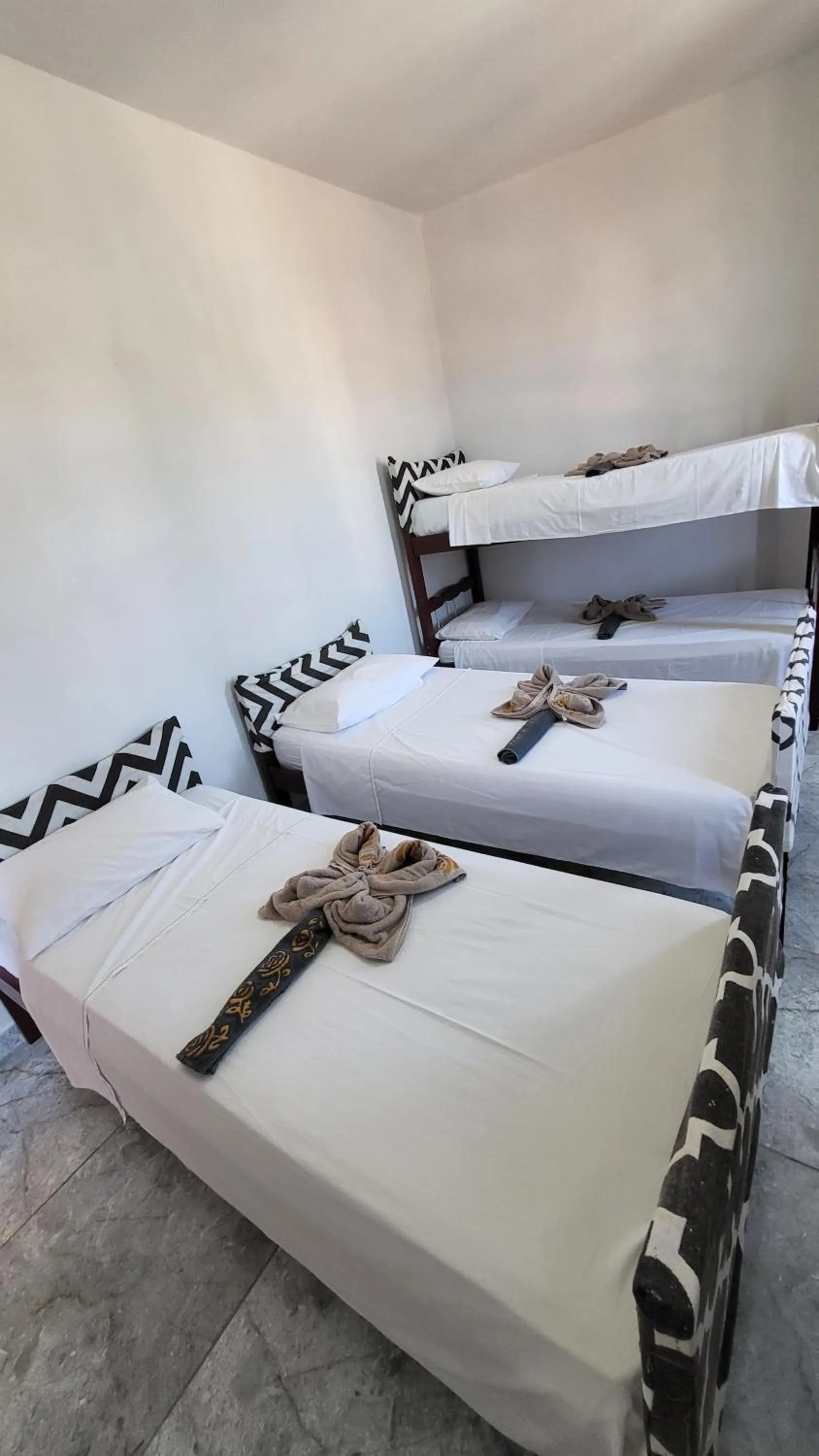 Bed in Tamboleiro's Hotel Residence