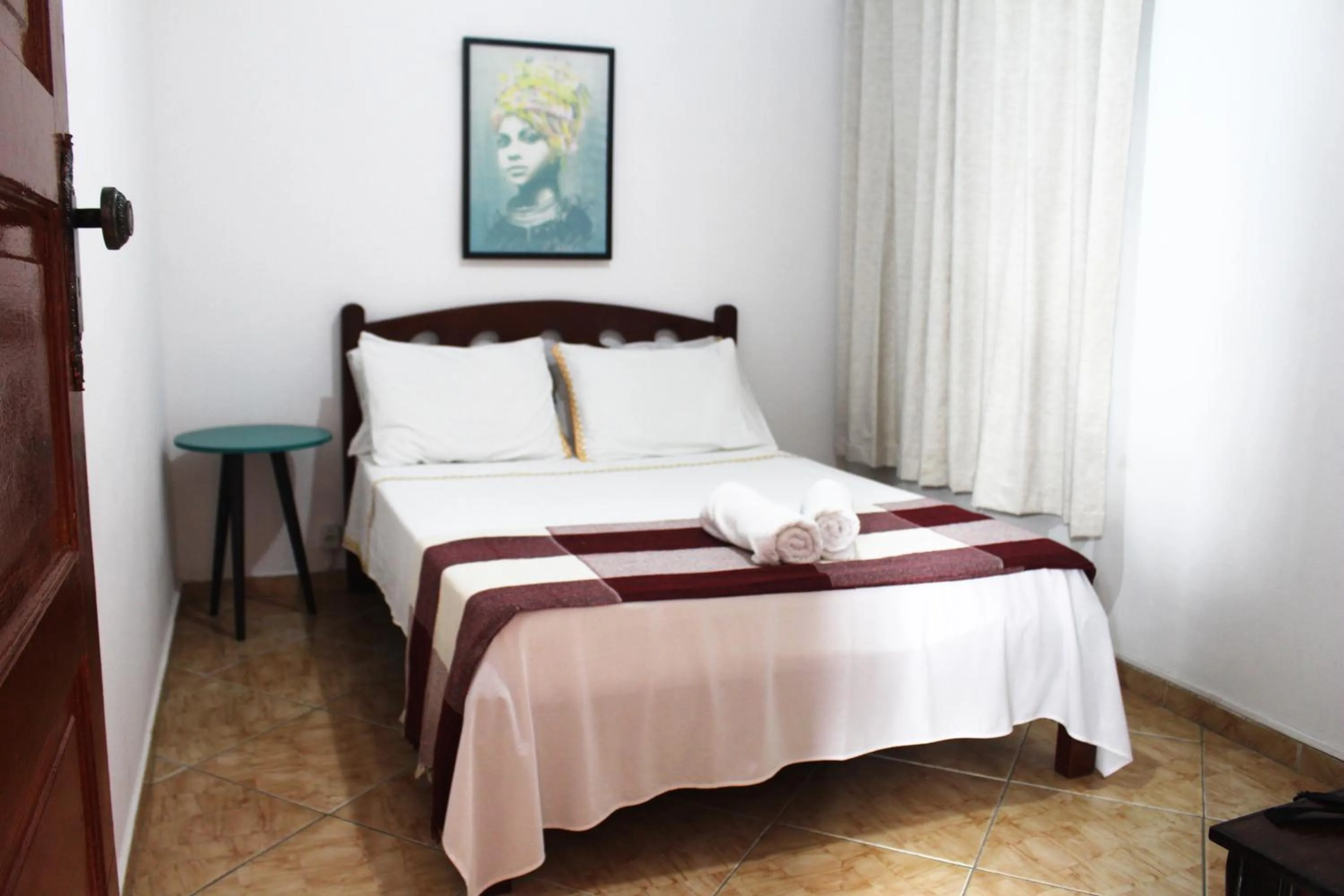 Bed in Tamboleiro's Hotel Residence