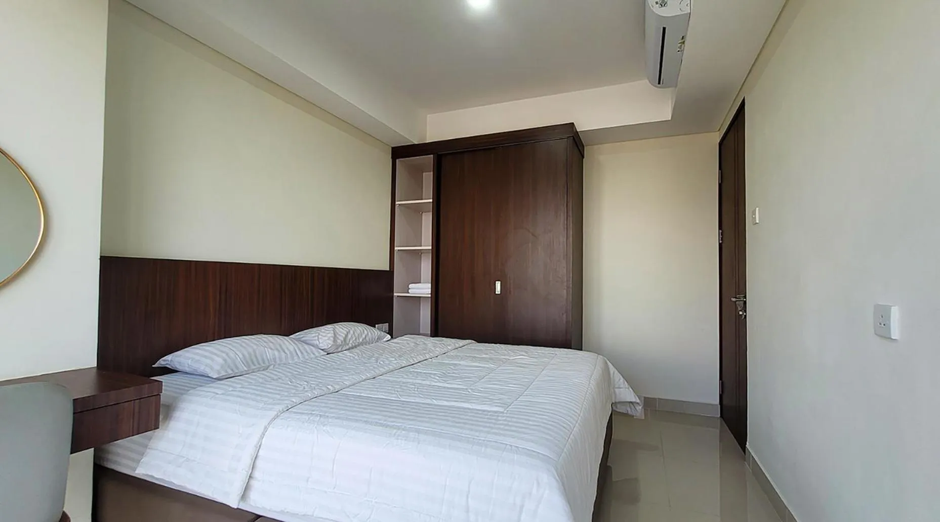 Bed in Palam Mansion at Meisterstadt Pollux Habibie Apartment