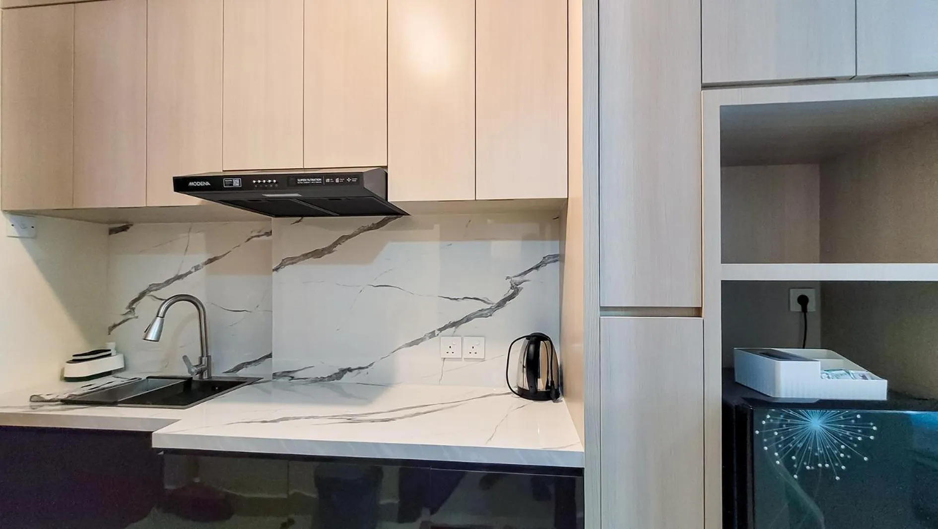 Kitchen or kitchenette in Palam Mansion at Meisterstadt Pollux Habibie Apartment