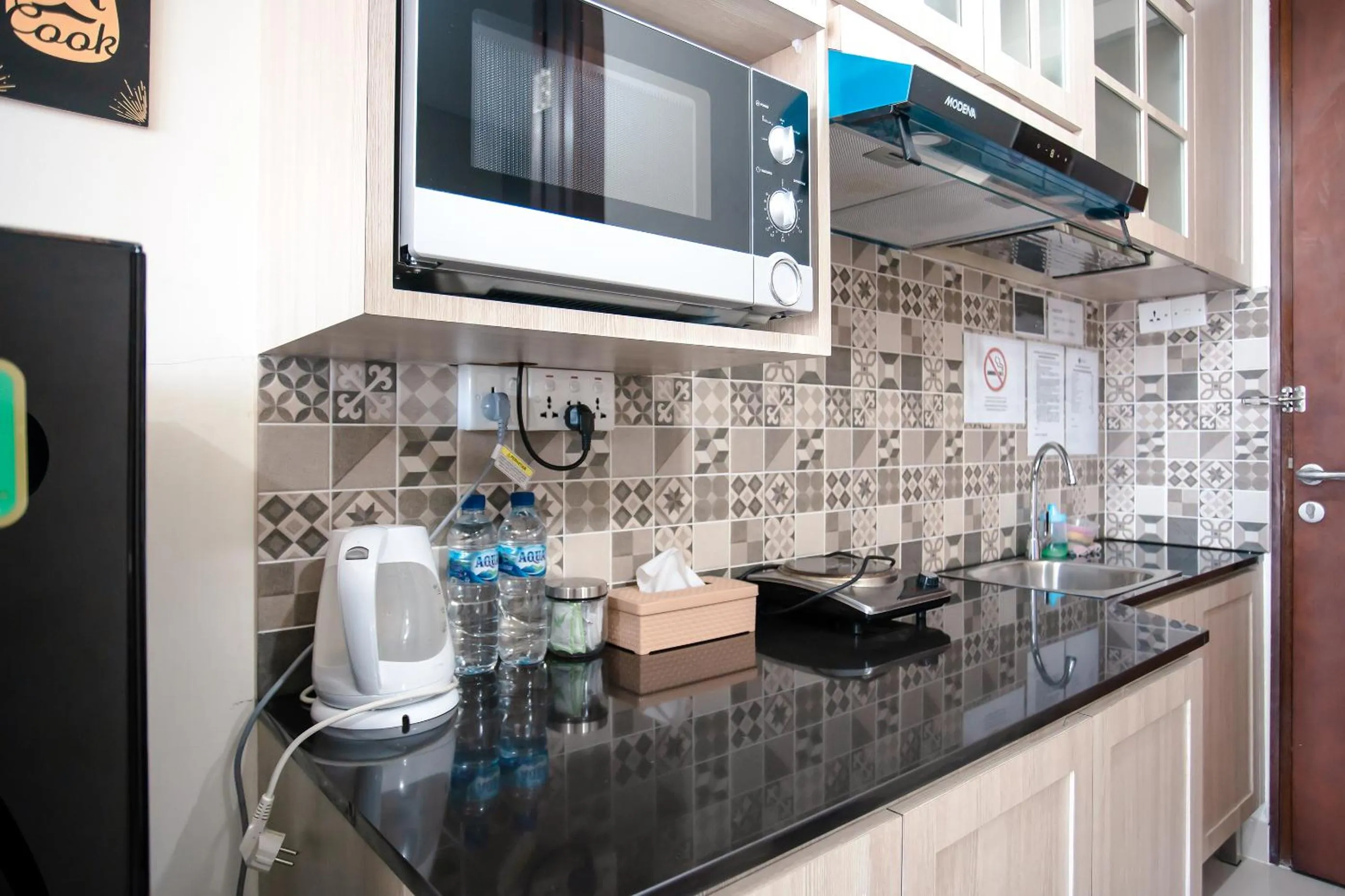 Kitchen or kitchenette in Palam Mansion at Meisterstadt Pollux Habibie Apartment