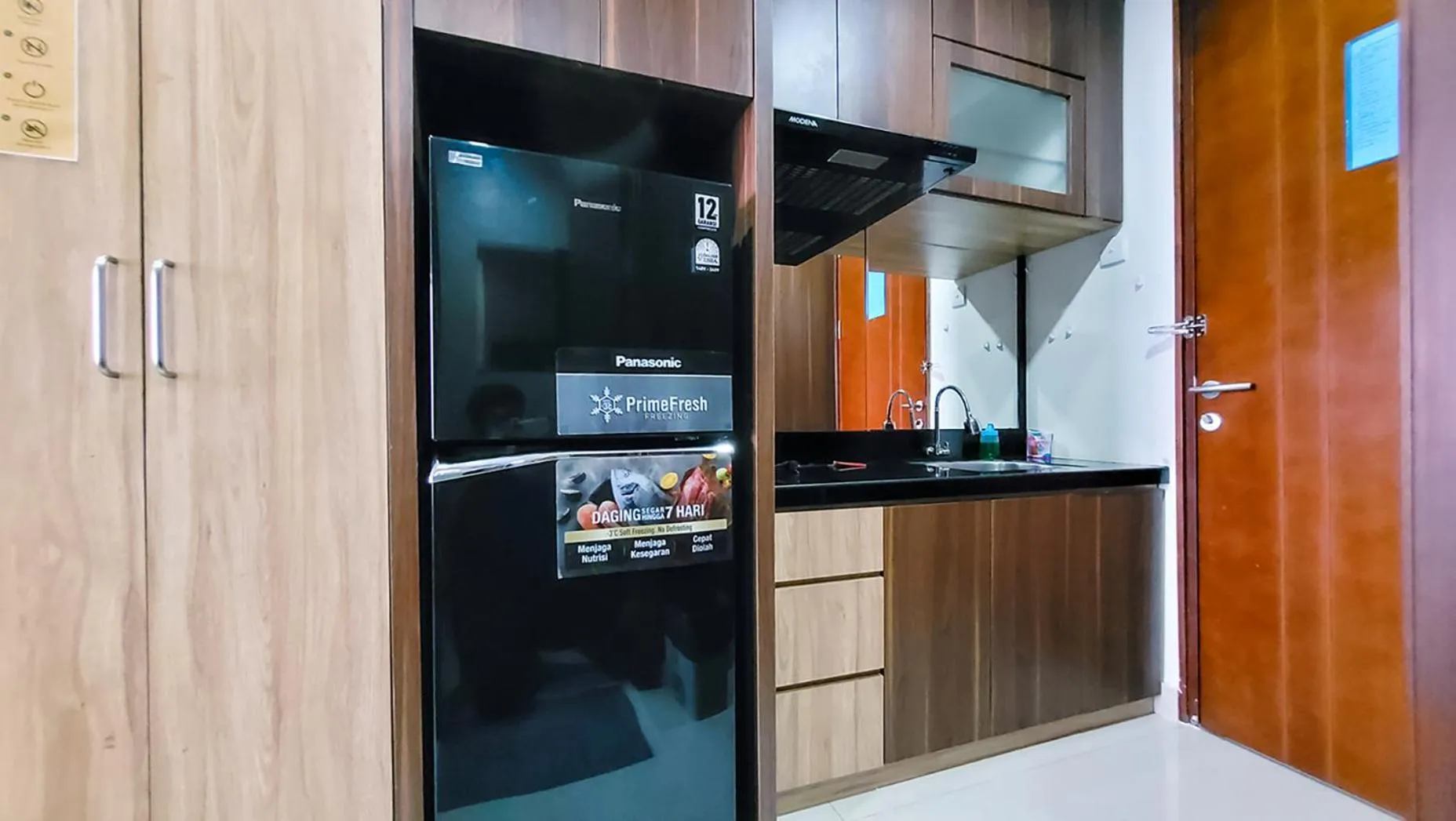 Kitchen or kitchenette in Palam Mansion at Meisterstadt Pollux Habibie Apartment