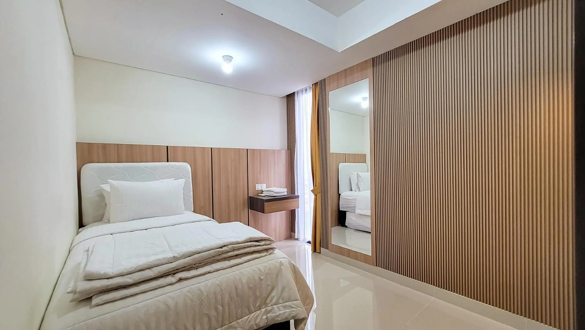 Bed in Palam Mansion at Meisterstadt Pollux Habibie Apartment