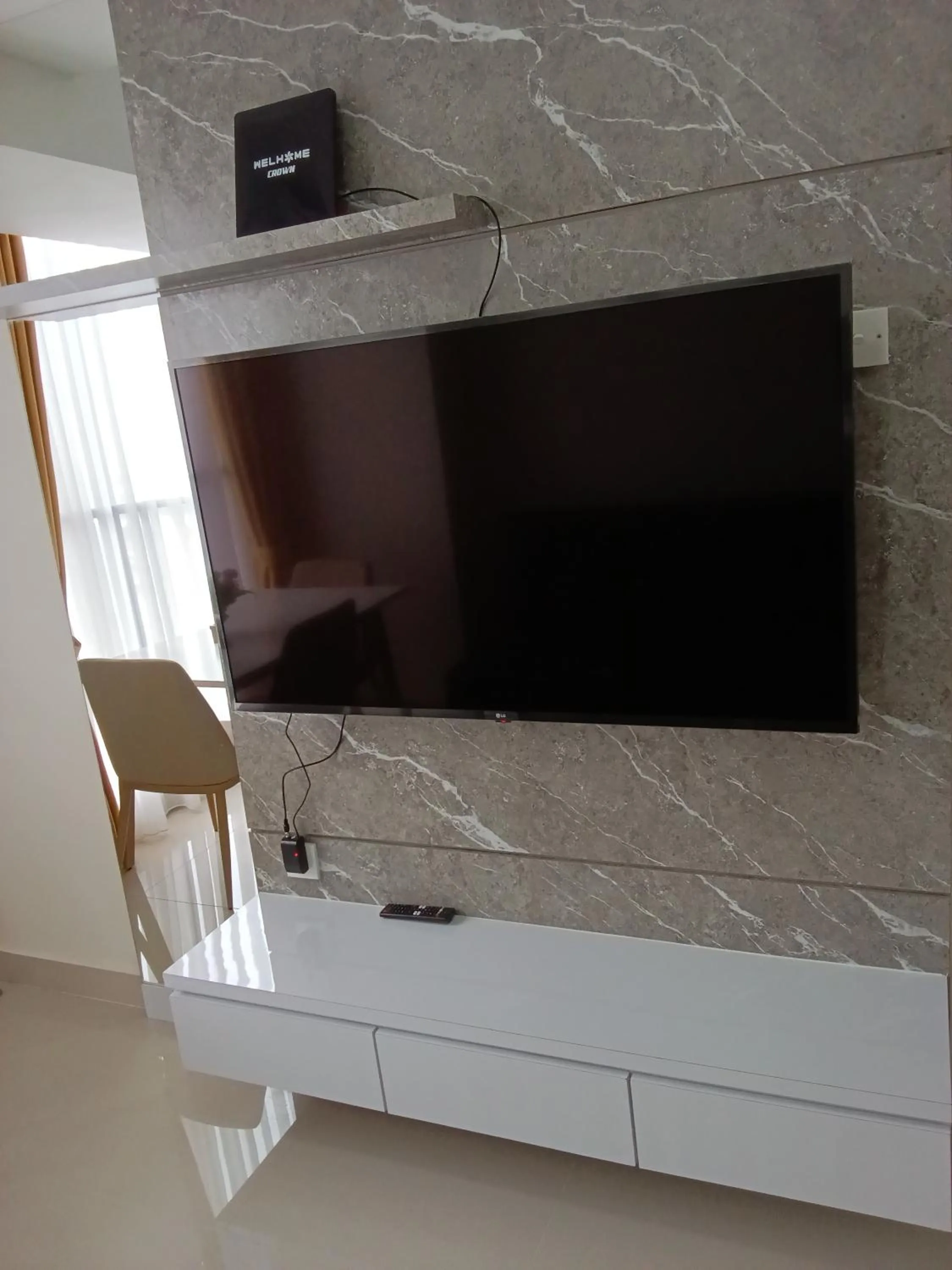 TV and multimedia in Palam Mansion at Meisterstadt Pollux Habibie Apartment