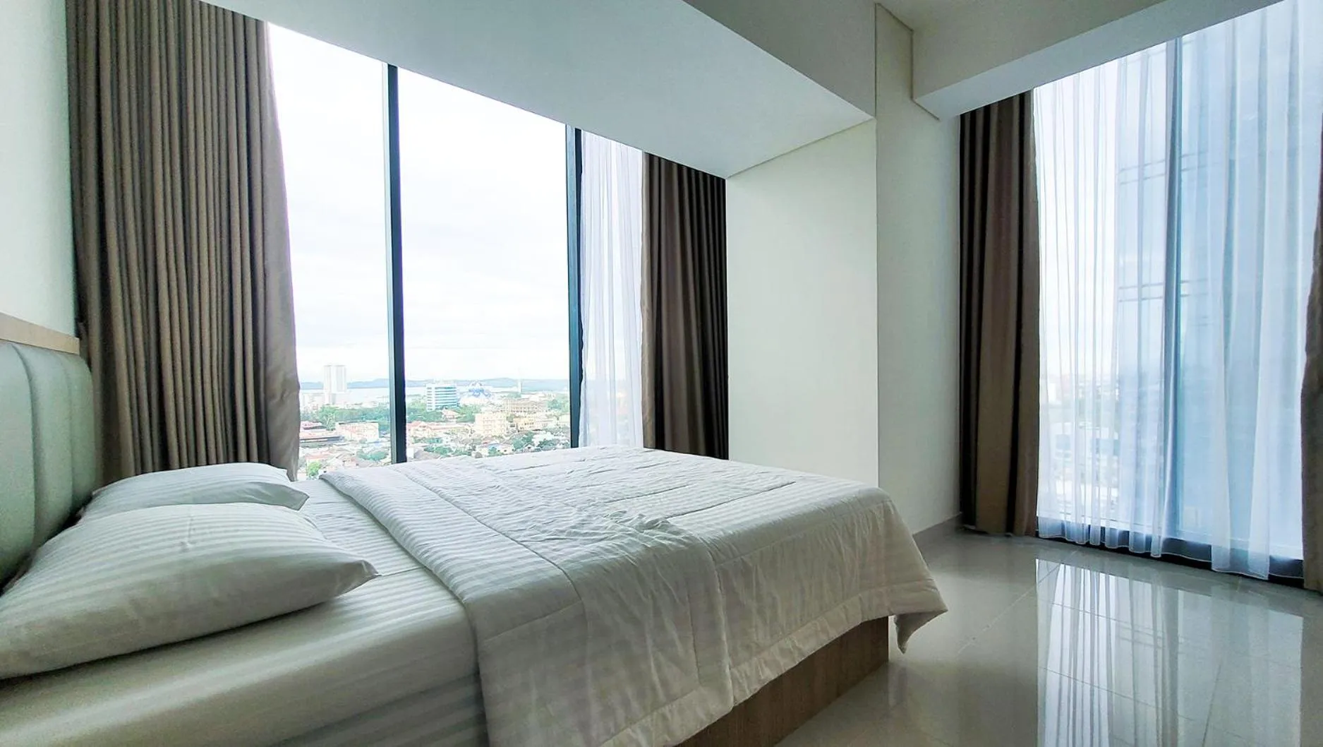 Bed in Palam Mansion at Meisterstadt Pollux Habibie Apartment